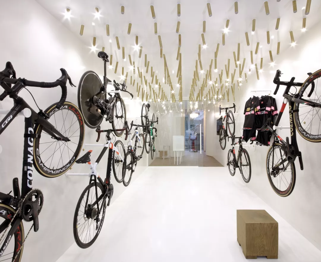 The interior  of a bike & coffee shop featuring HIMACS
