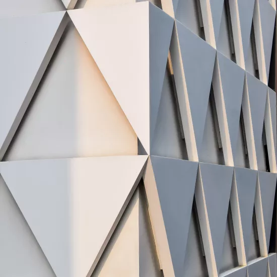 A sculptural, geometric façade made of HIMACS for JK House