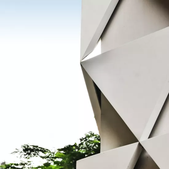 A sculptural, geometric façade made of HIMACS for JK House