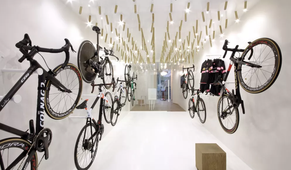 The interior  of a bike & coffee shop featuring HIMACS