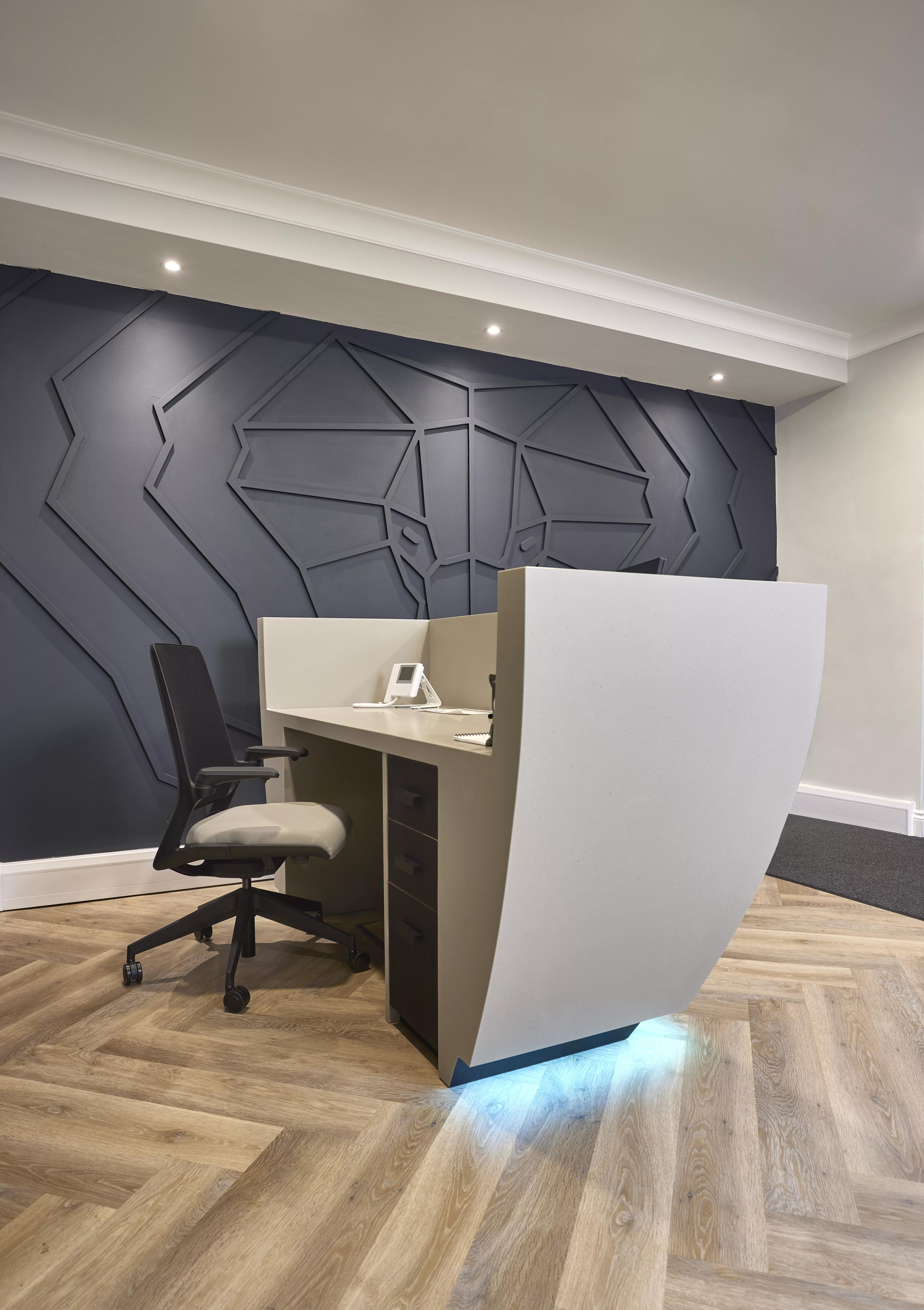 HIMACS creates a striking and sculptural reception desk at Pitalia’s new Manchester office
