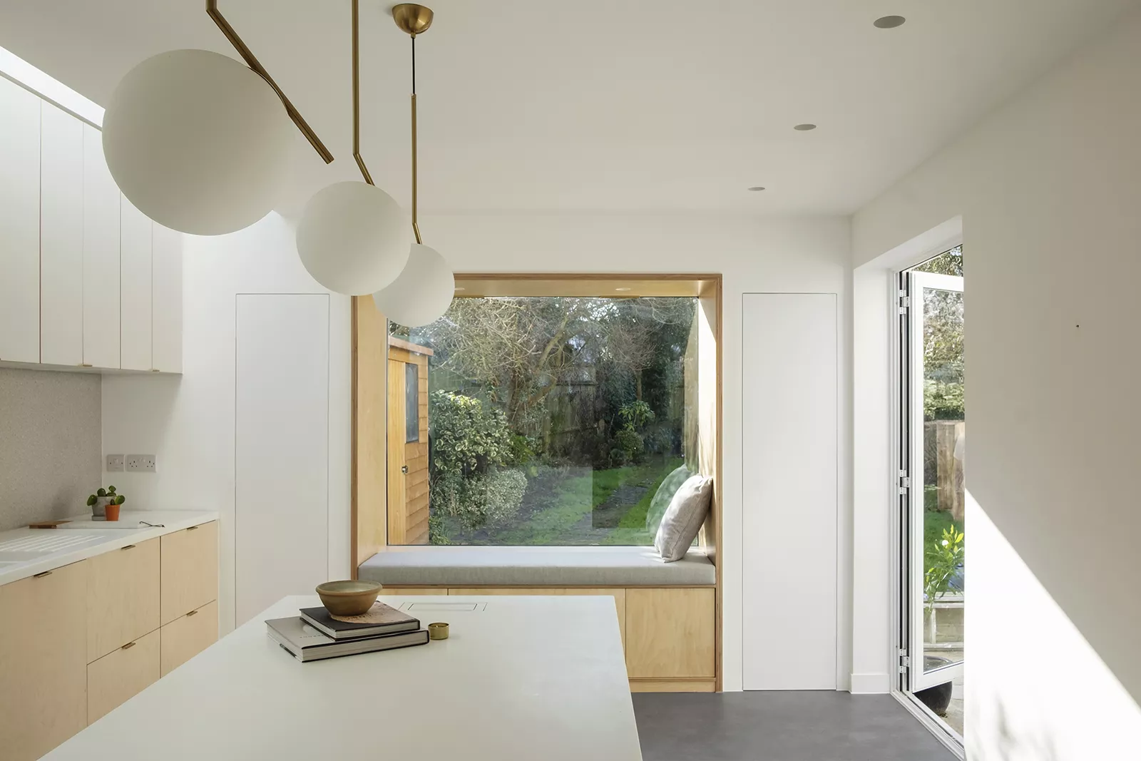 A dreamy minimalist kitchen with HIMACS elements in the Nook House