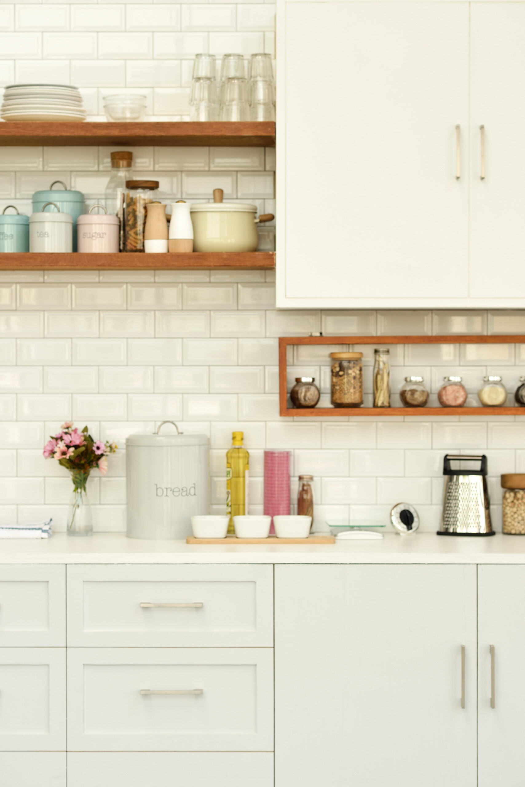 loating shelves in various pale hues in a white kitchen can create a stylish combination.