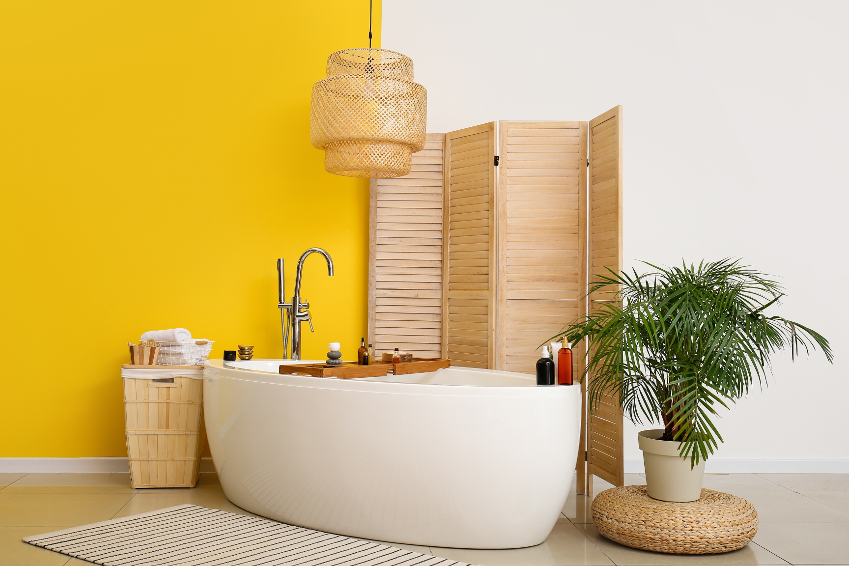 Yellow accents can add a lively, bright energy to a powder room.