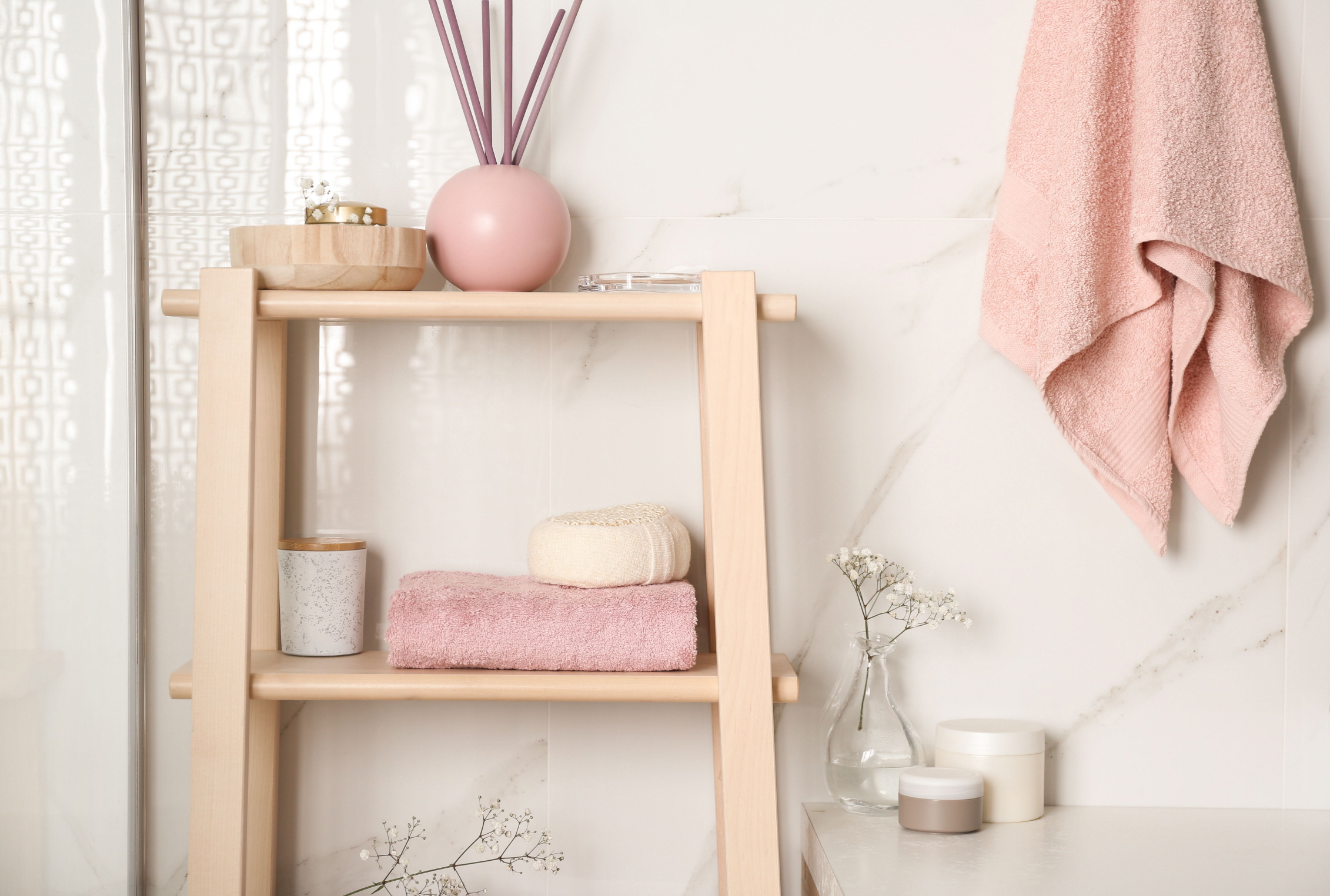 Rose gold-colored items add a touch of modern elegance to your powder room.