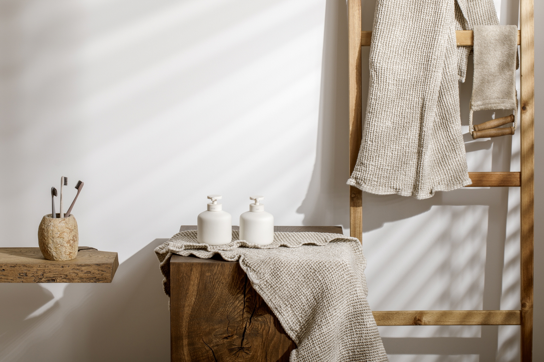 To give your powder room a cozy feel, try incorporating wood elements into your shelving and decor.