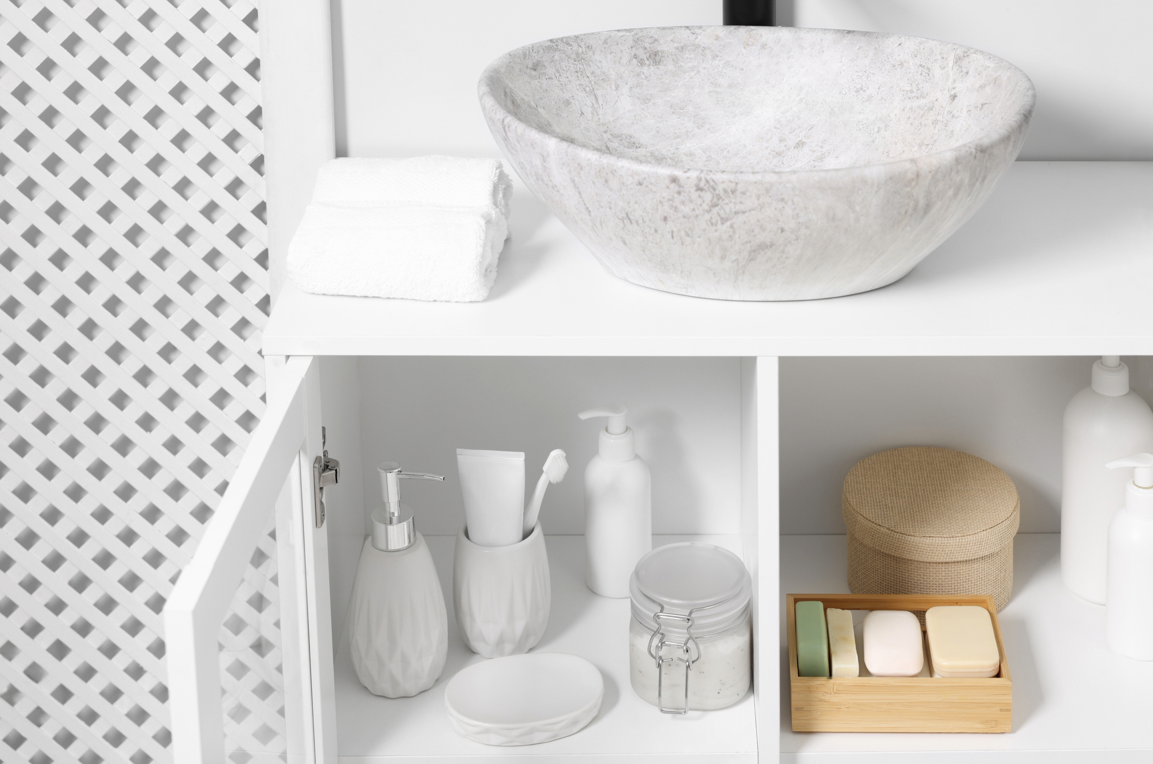 Consider using shelving, cabinets, or storage units for an efficient storage solution in a small powder room.