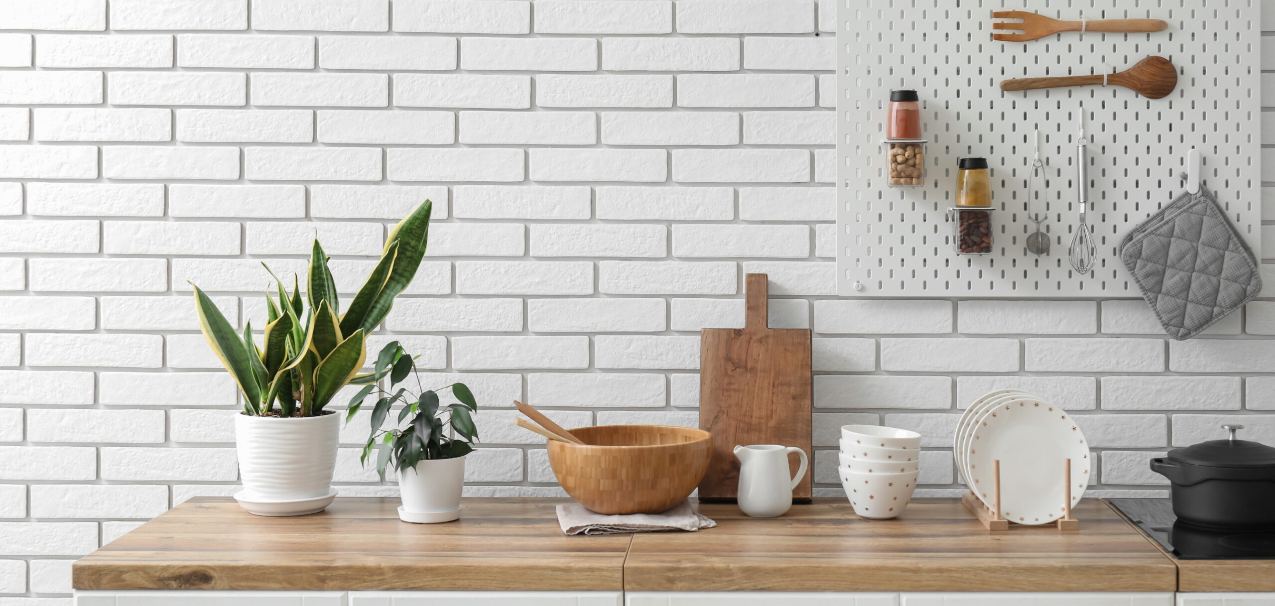 Hanging your favorite utensils on pegboards not only makes them accessible but also creates an attractive focal point.