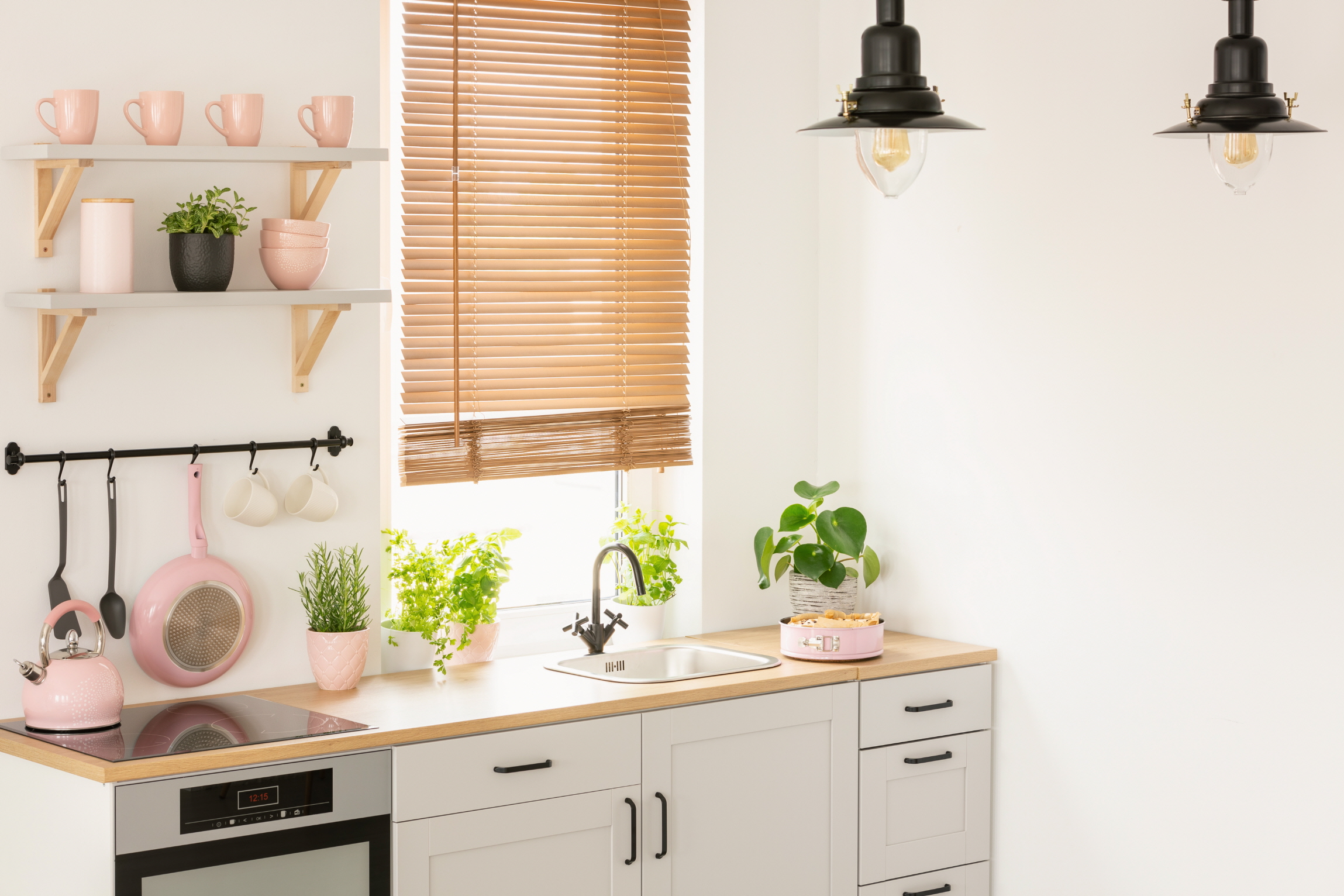 Plants can be used as corner accents or shelf decorations to introduce natural colors into your kitchen space.