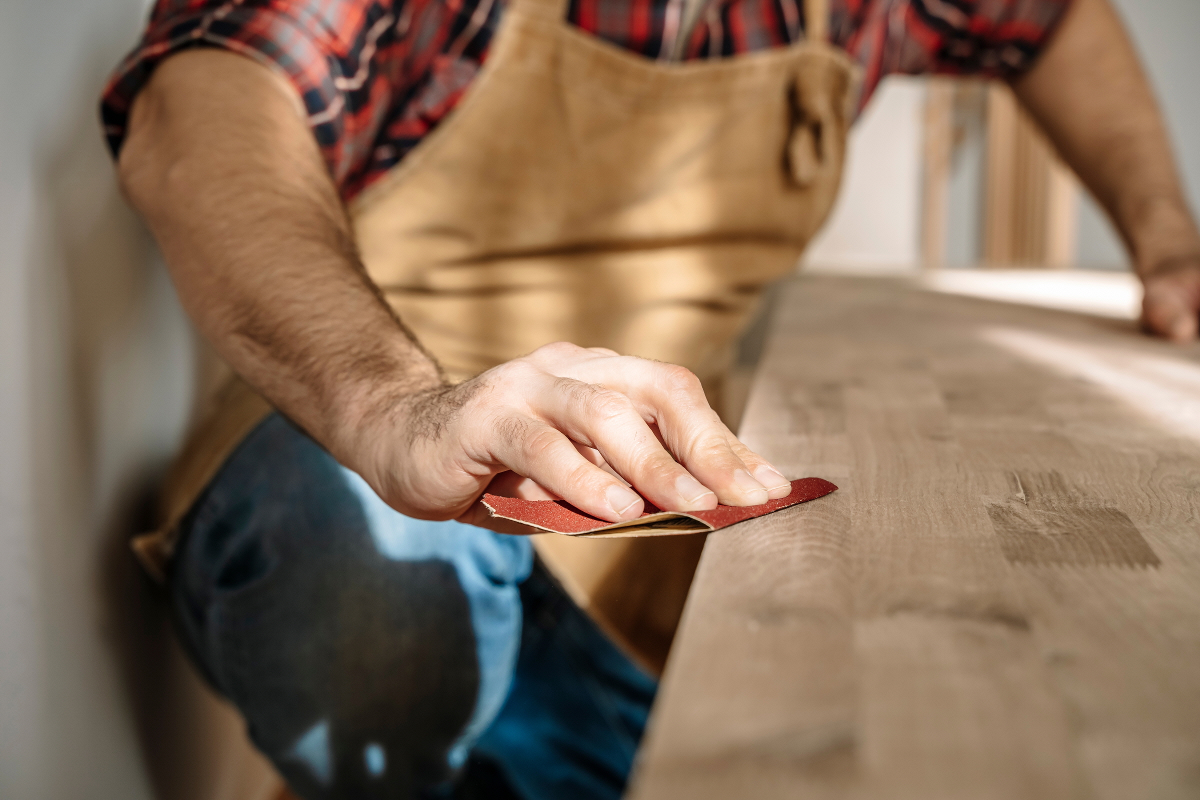 After you've finished all the cutting and routing, smooth out the door's surface using sandpaper or a sanding block.