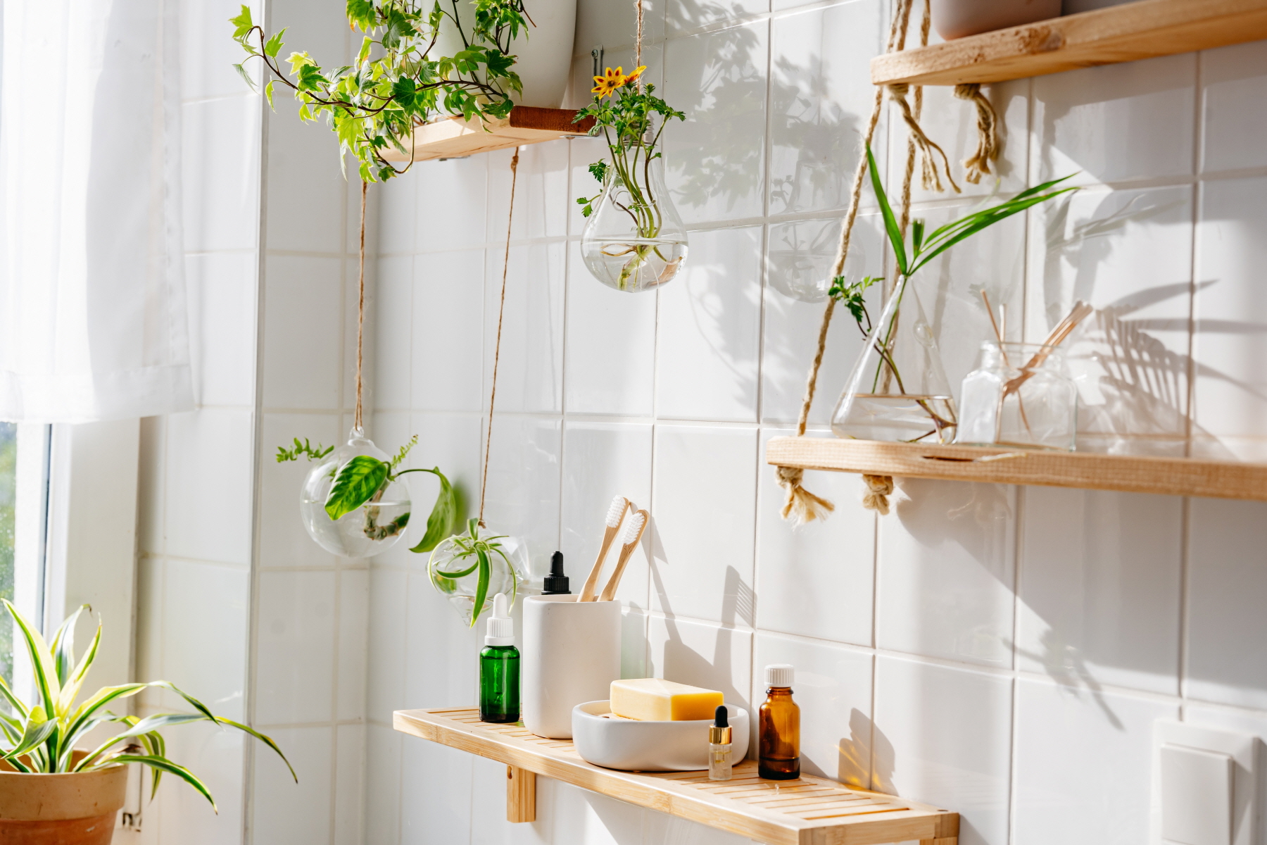 Display indoor plants to add life and a pop of color to your bathroom space.