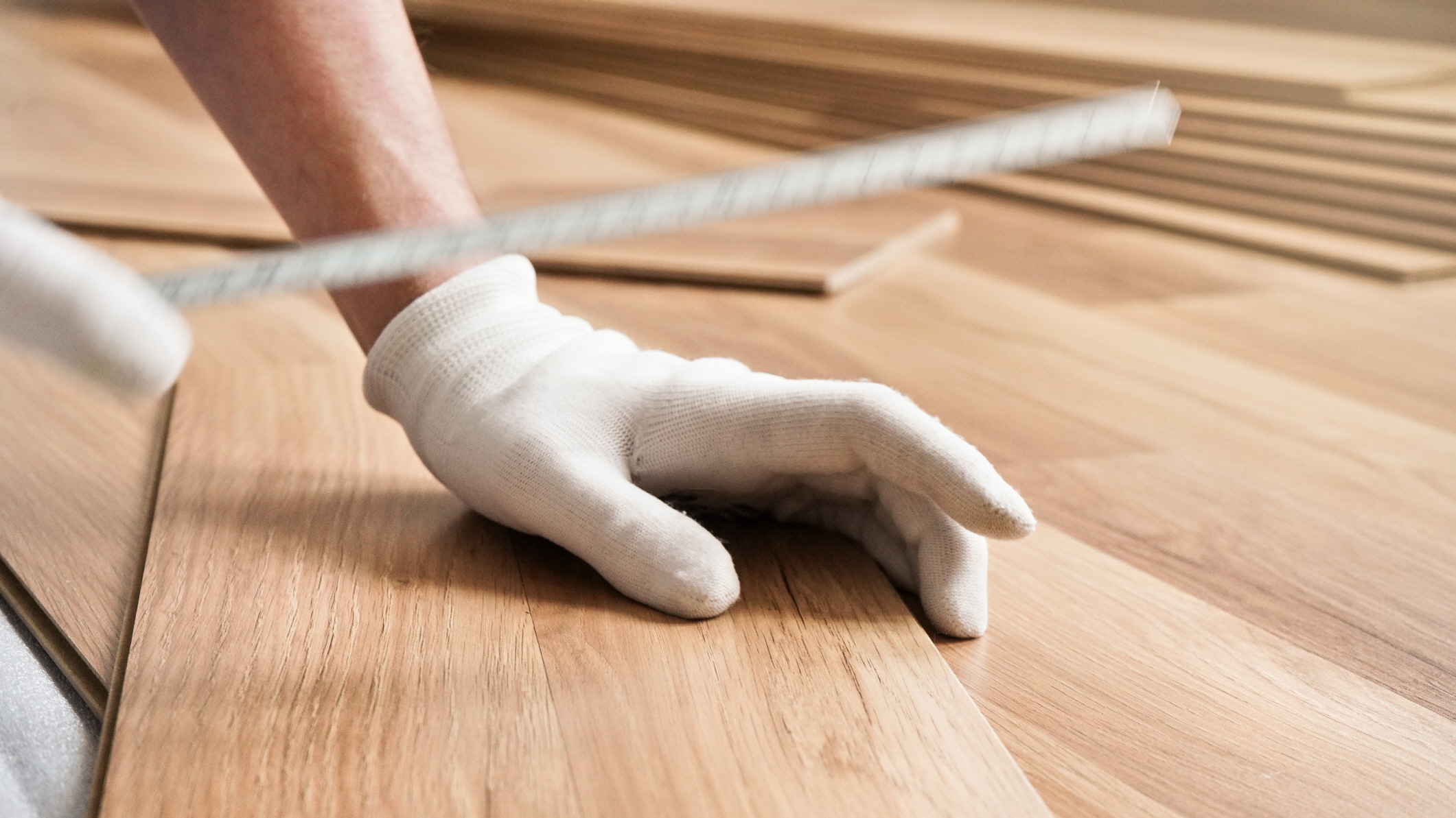 Install laminate flooring alongside wall panels to achieve a cohesive bathroom look.