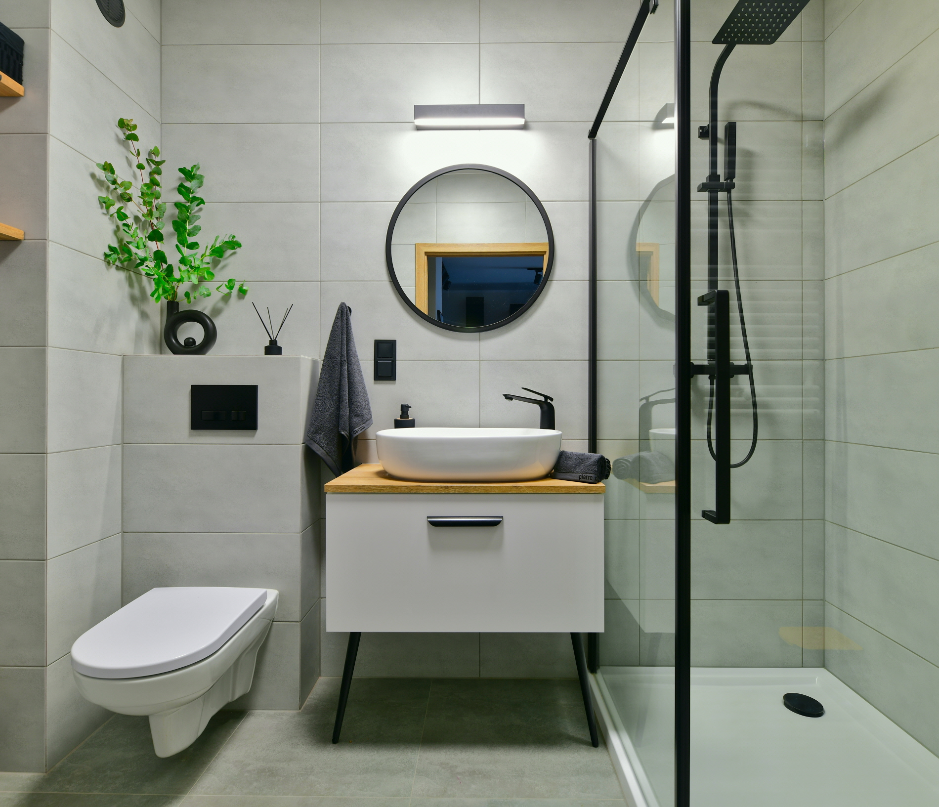 Choose a compact toilet, sink, and shower in a small bathroom to create a spacious and comfortable atmosphere.