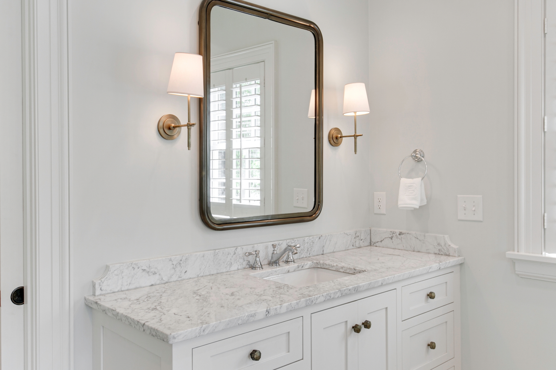 Replacing the sconces in your bathroom can enhance the ambiance and functionality of the space.