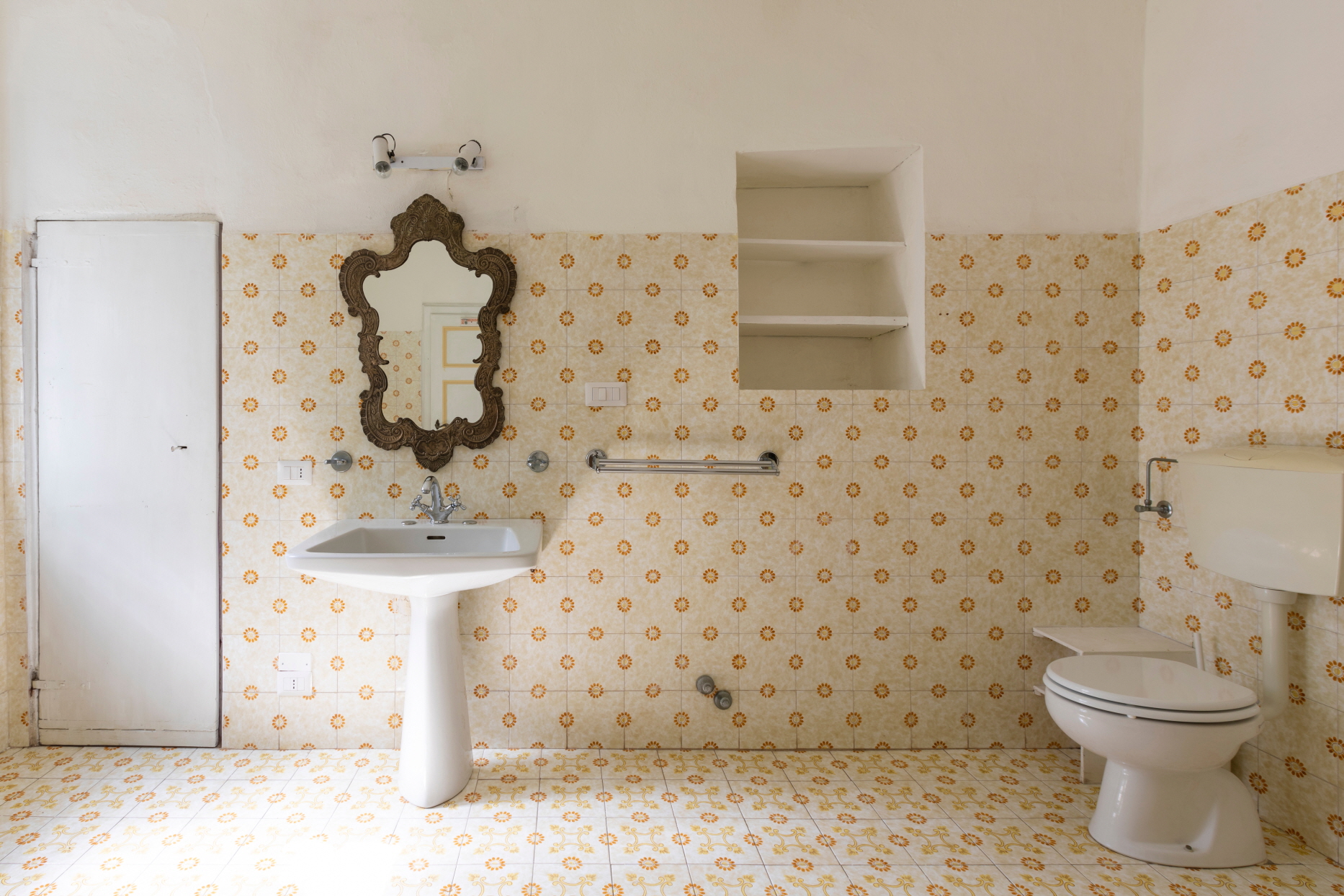 A high-tank toilet in a historic home is a classic design that beautifully completes the aesthetic of a vintage space.