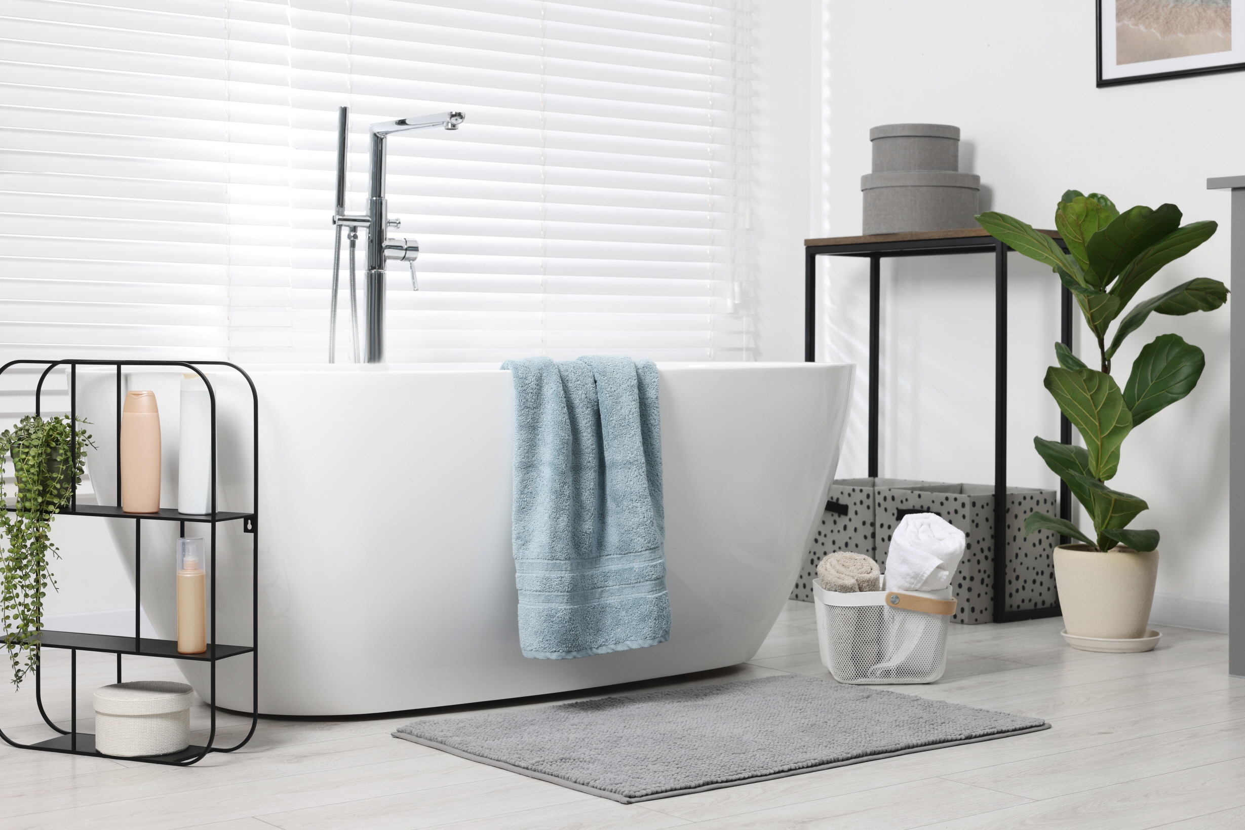 Introducing natural accent colors can transform a white bathroom into an oasis of calm and relaxation.