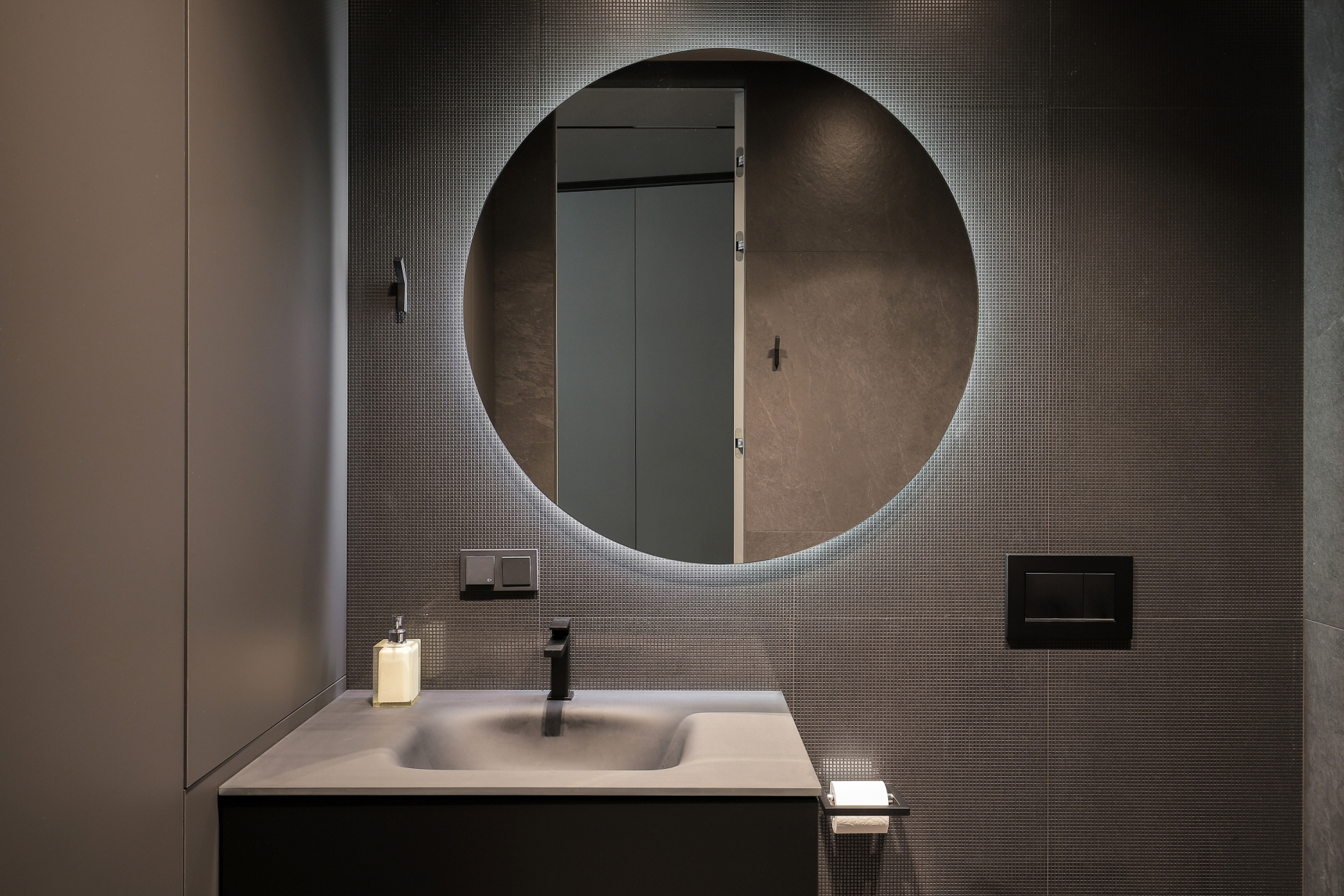 Add a stylish touch with creative lighting, such as backlighting behind a mirror.