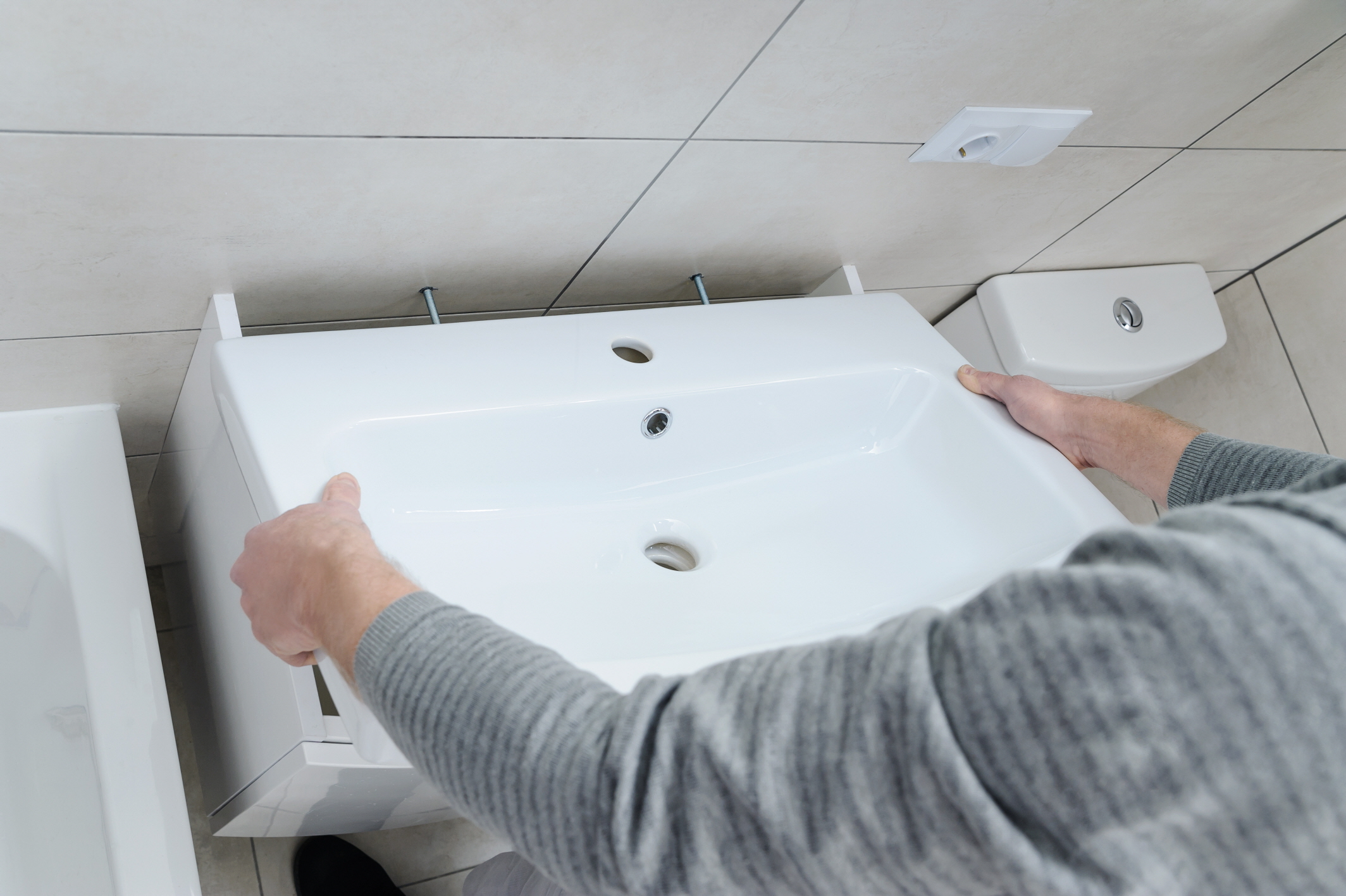 When removing the sink, you must be careful not to damage the surrounding countertops.