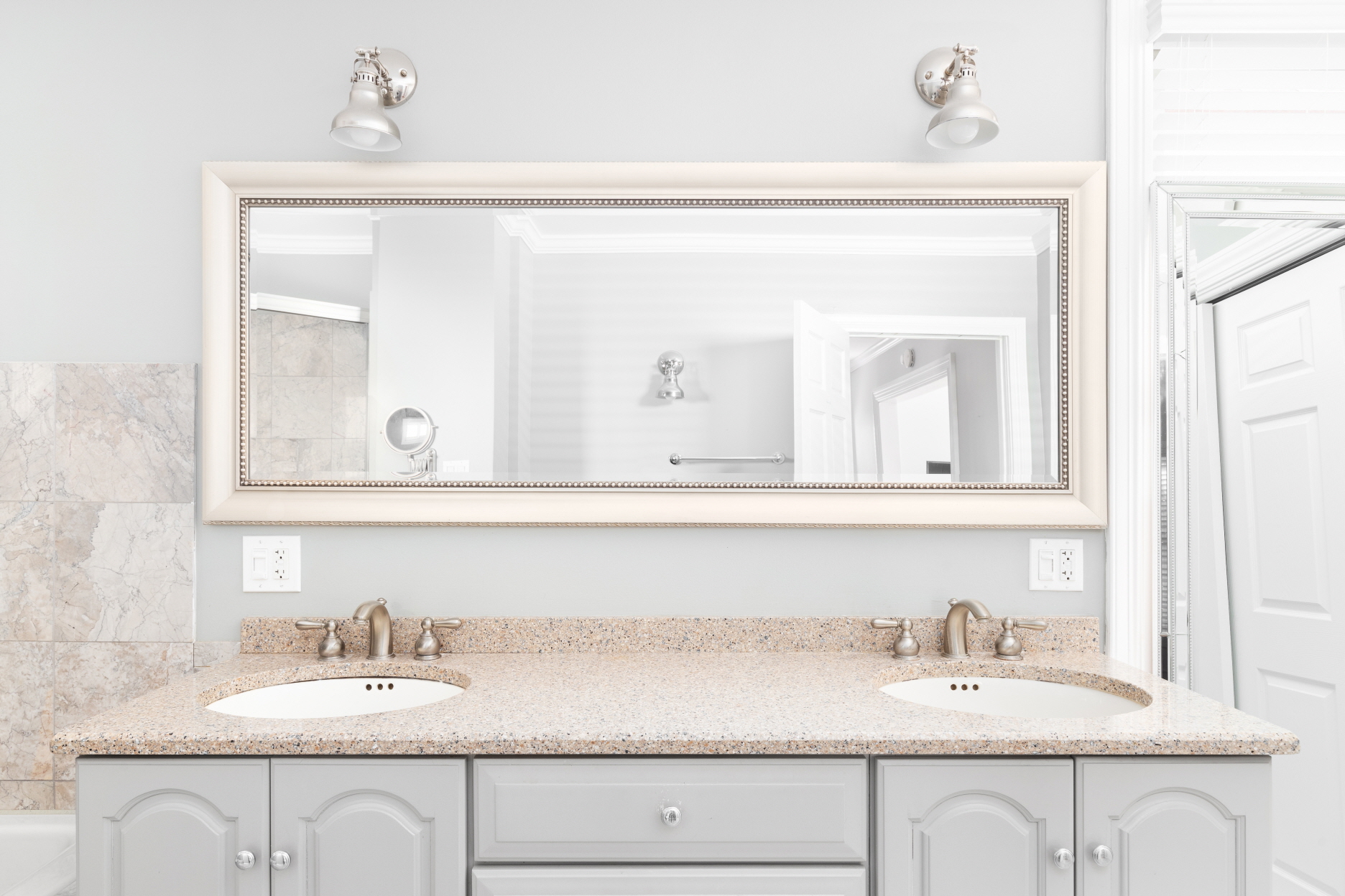 A new mirror can be a focal point in your bathroom and make the space more inviting.