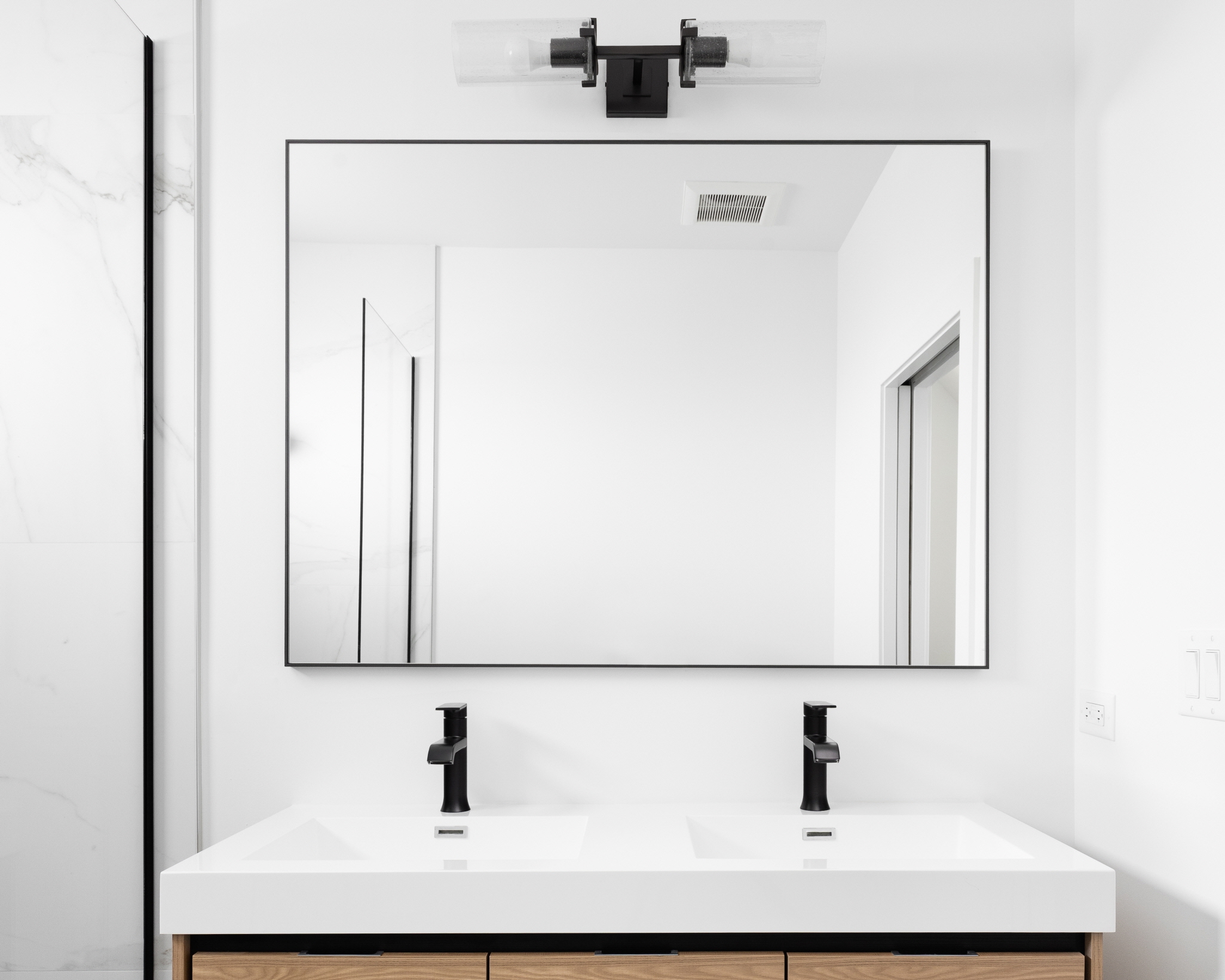 A large mirror in the bathroom can reflect light and create the illusion of a bigger space.