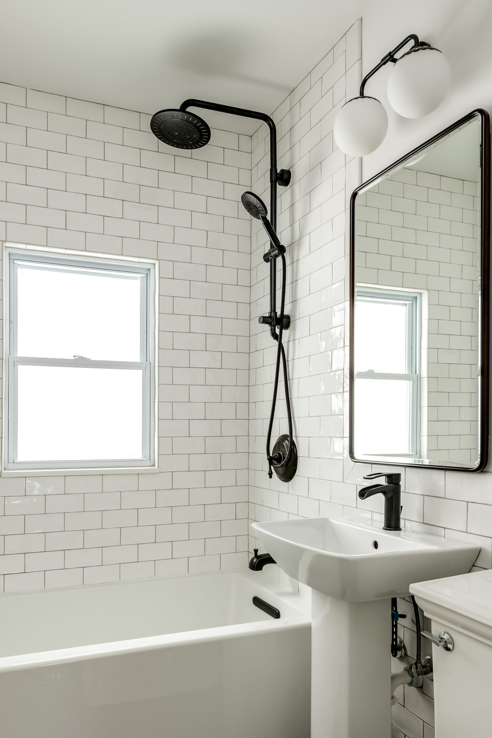 Create the illusion of a larger bathroom by freeing up floor space with a pedestal sink.