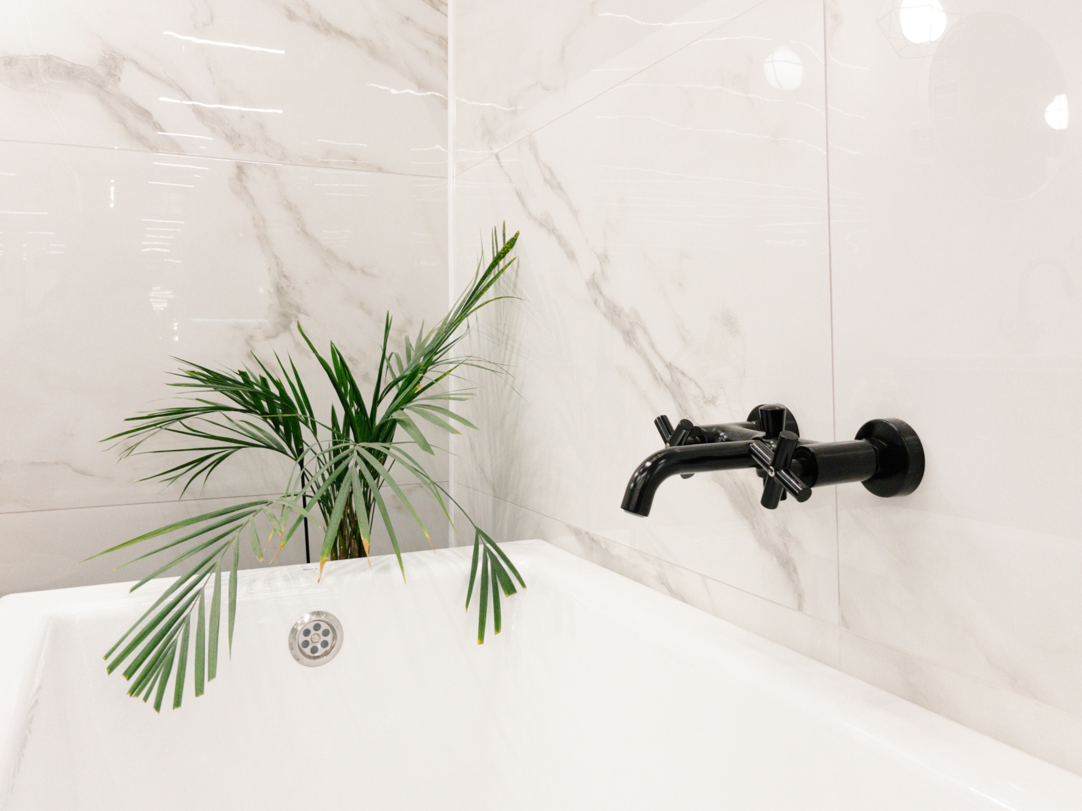 Marble is prized for its durability and water-resistant properties, beyond just its aesthetic appeal, making it an excellent choice for bathrooms.