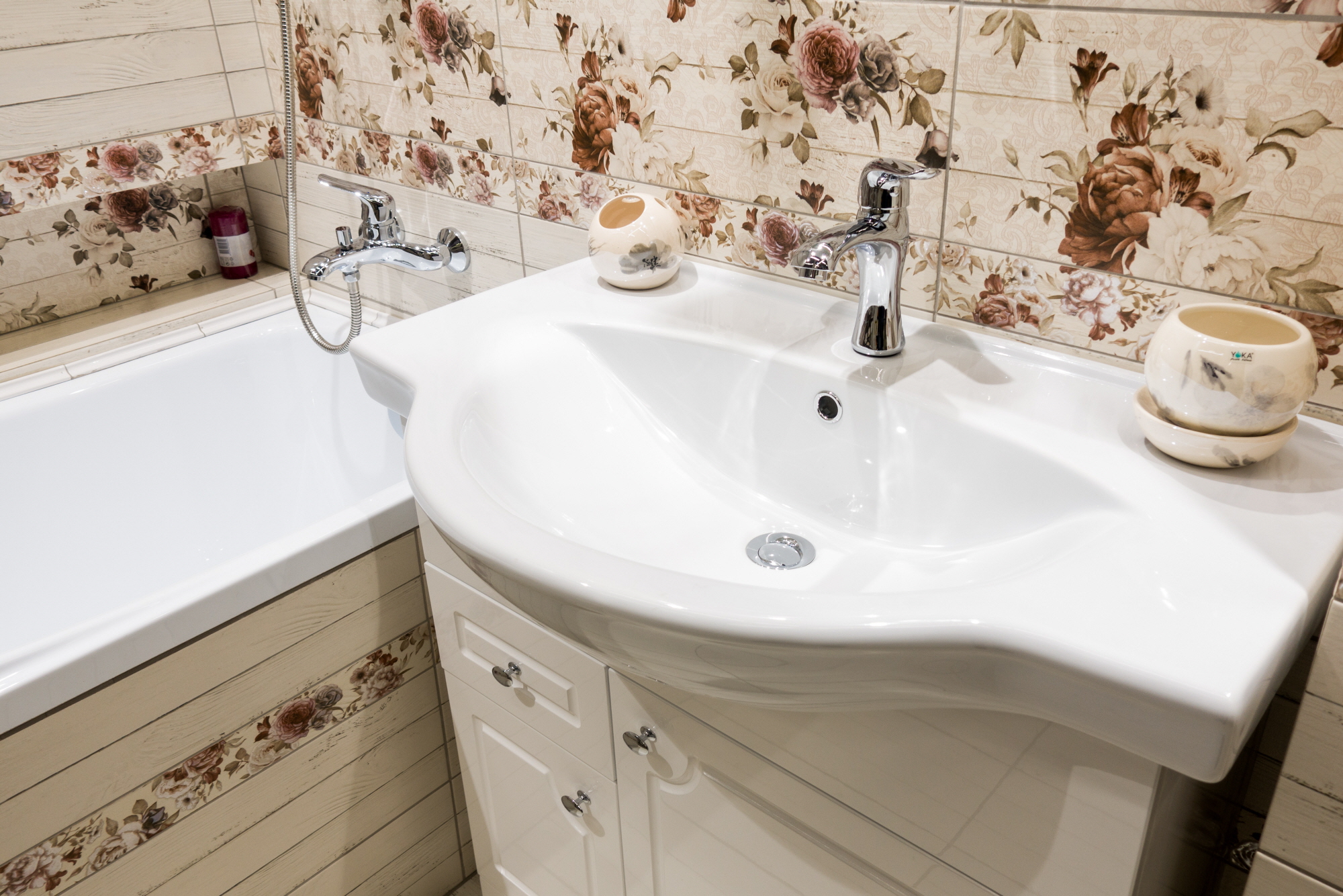 Transform your bathroom into a romantic retreat with floral wallpaper.