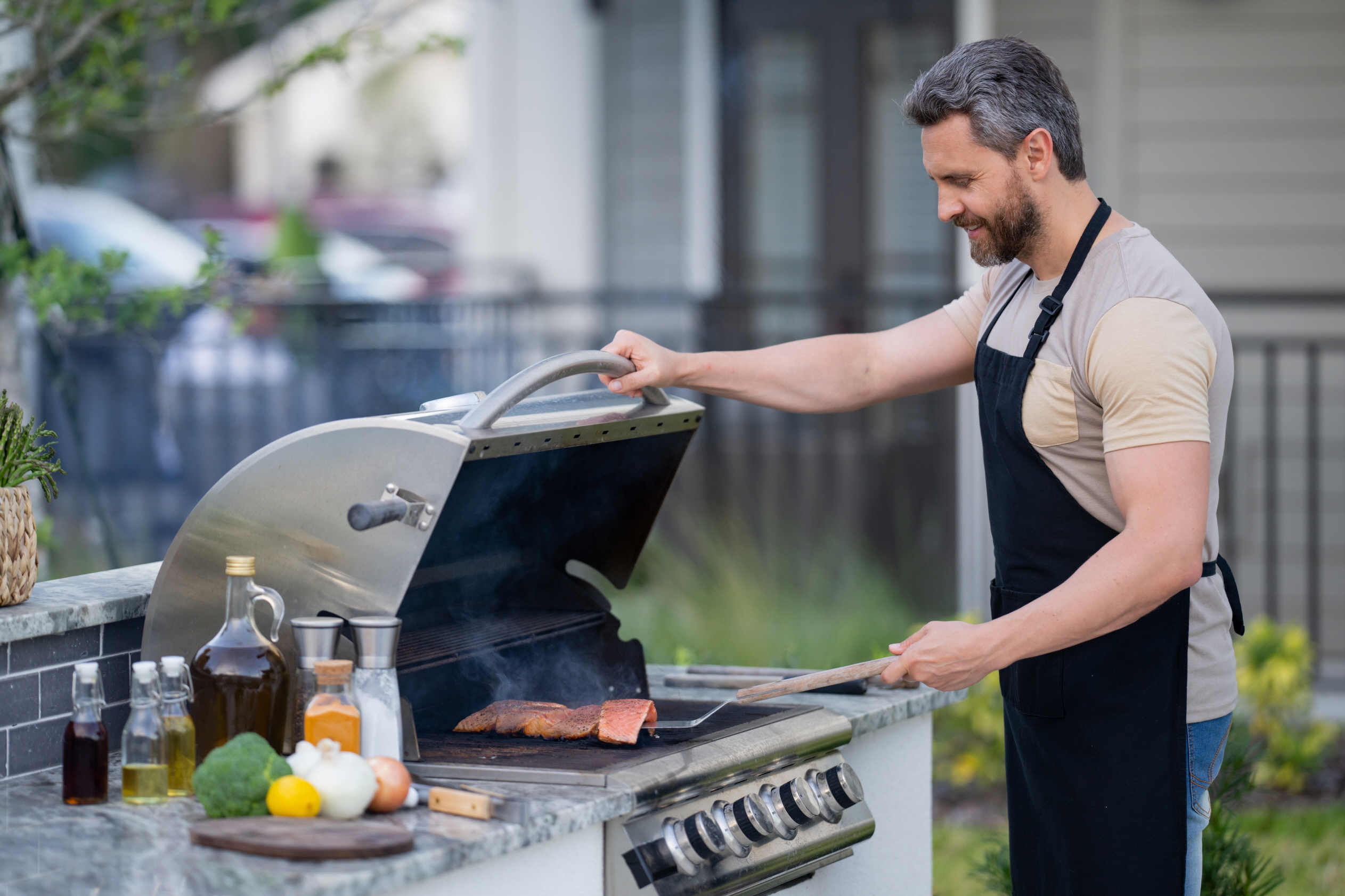 An outdoor kitchen not only allows for socializing outdoors but also helps reduce indoor heat from cooking and maintain a cleaner indoor environment.