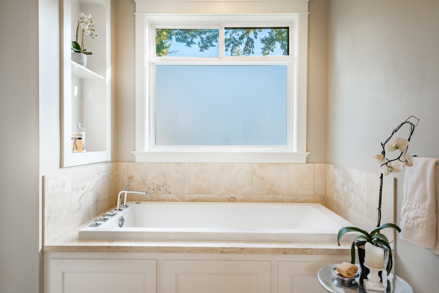 Installing large windows is a fantastic way to boost natural light in a small bathroom.