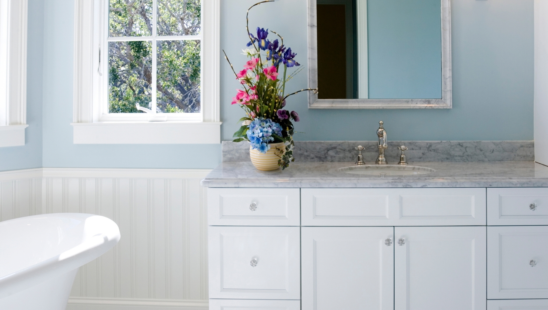 The bright blue elements infuse a cheerful and vibrant vibe into the bathroom transformation.