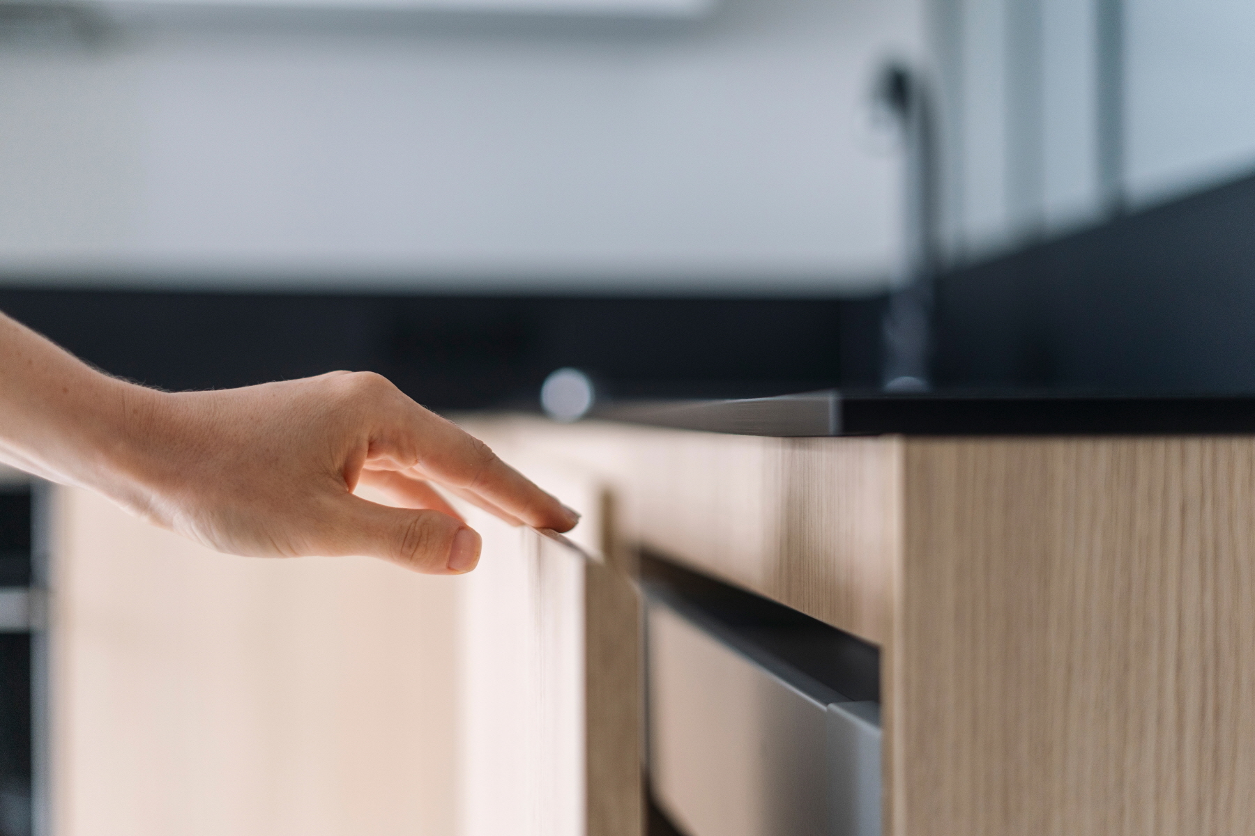 Using wood for the drawer fronts can enhance your kitchen's aesthetic and create a modern atmosphere.