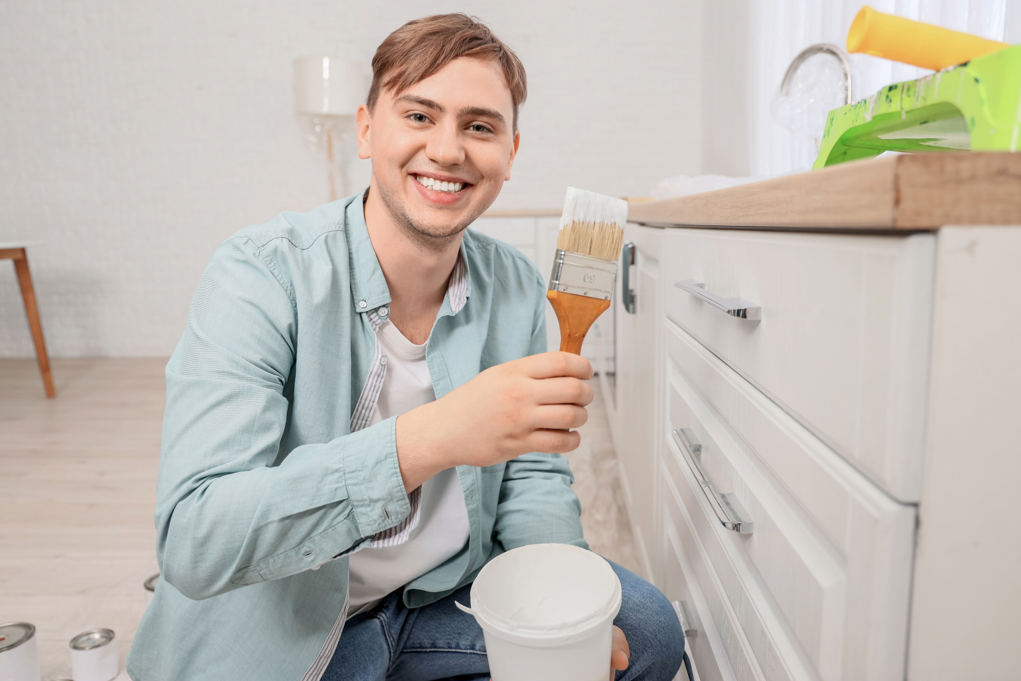 You can upgrade your kitchen cabinets by applying a fresh coat of paint.