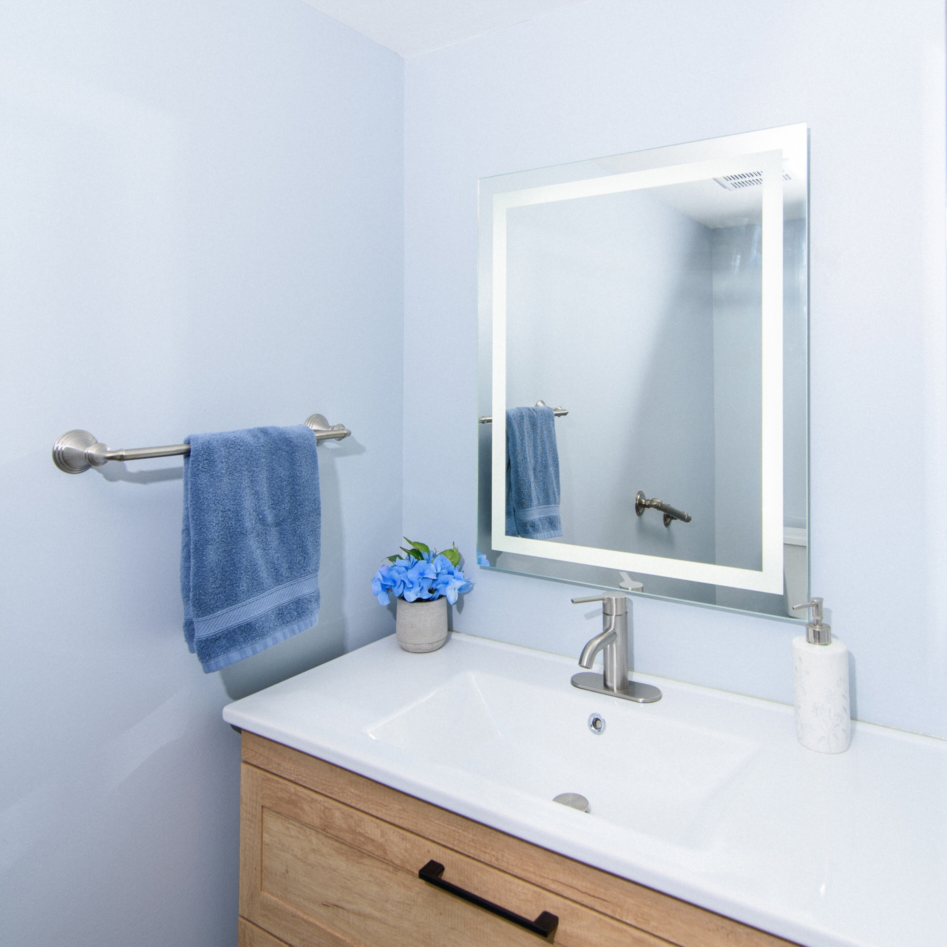 Opt for a light blue color that evokes calm and serenity to create a beautiful, timeless bathroom space.