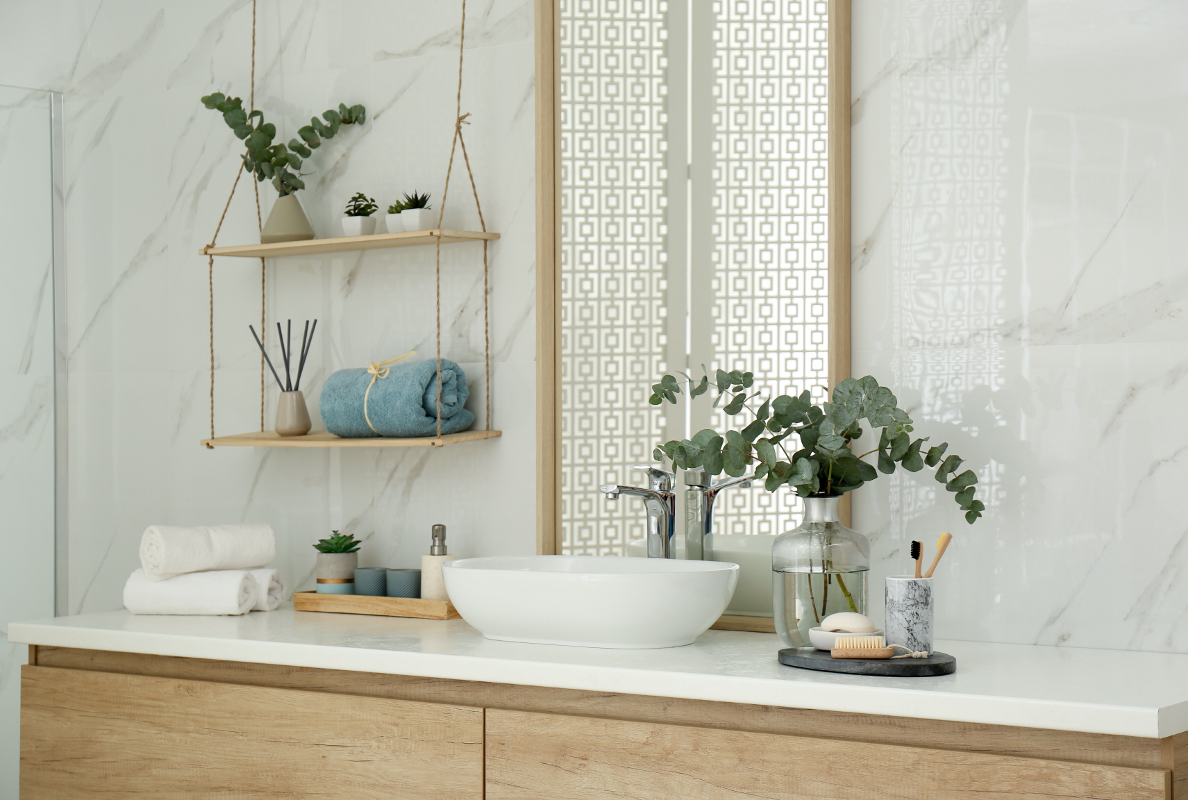 You can further enhance your bathroom layout by incorporating floating shelves.