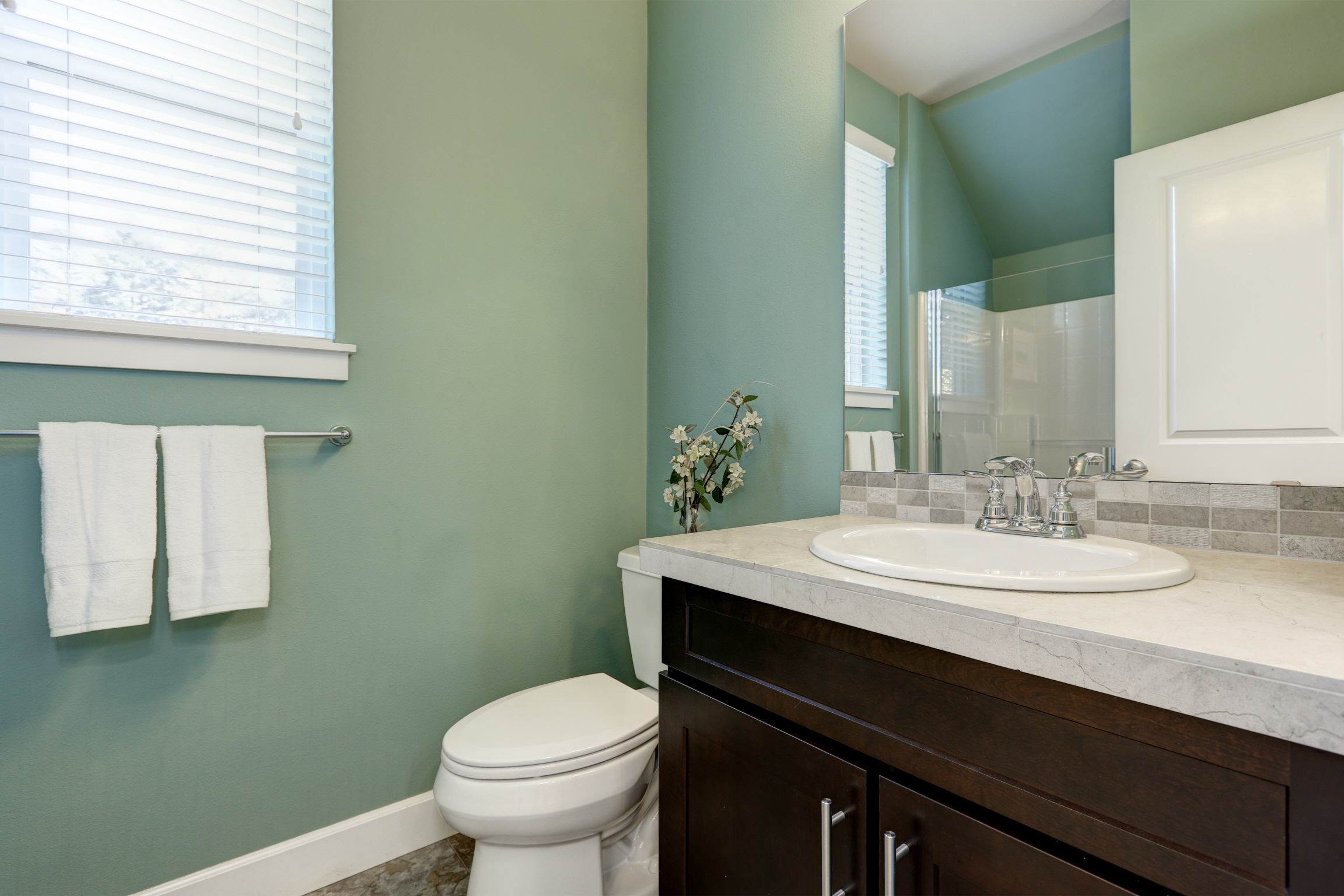 Minty green is a crisp, bright color that complements bathrooms filled with natural light.