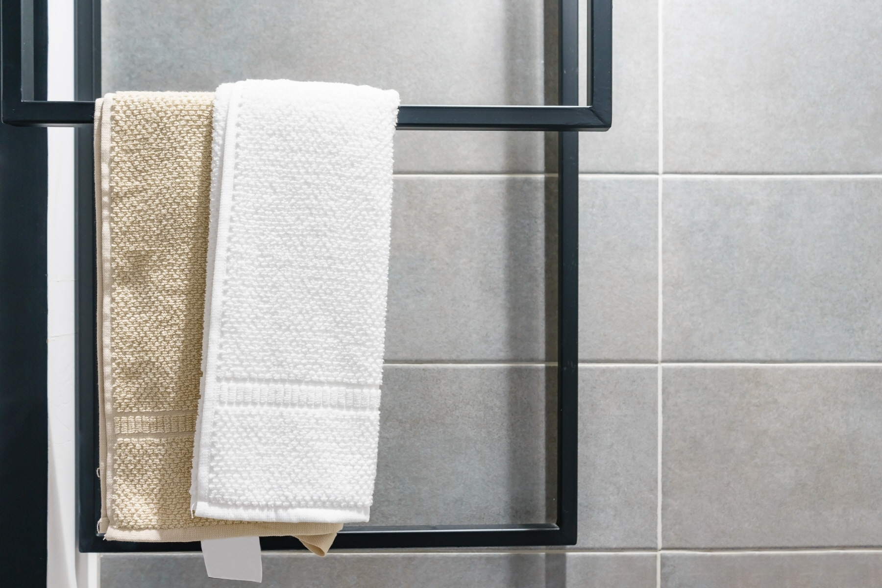 Towel racks, available for $5 to $25, are a great tool for helping you keep your bathroom tidy.