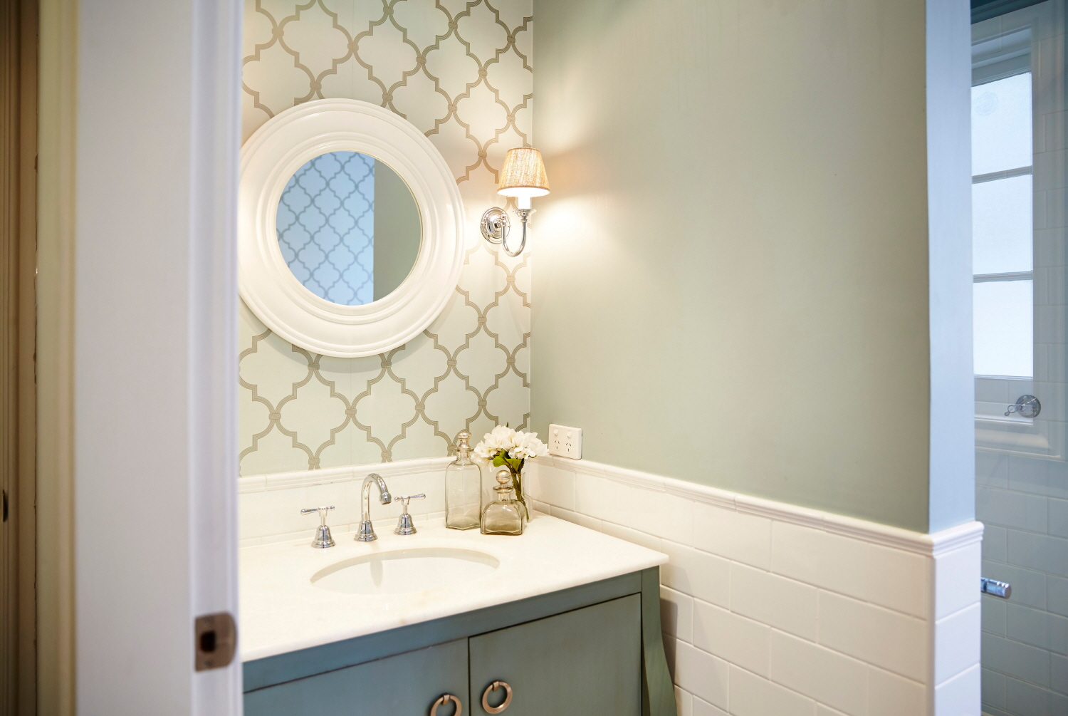 Using wallpaper in the guest bathroom can make a striking design statement.