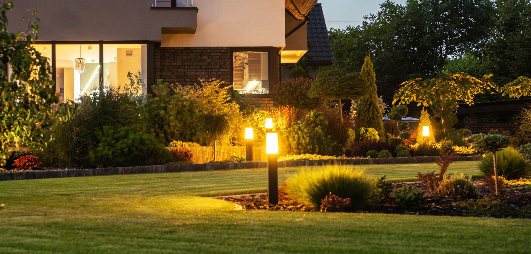 Use layering techniques to maximize your home's exterior lighting.