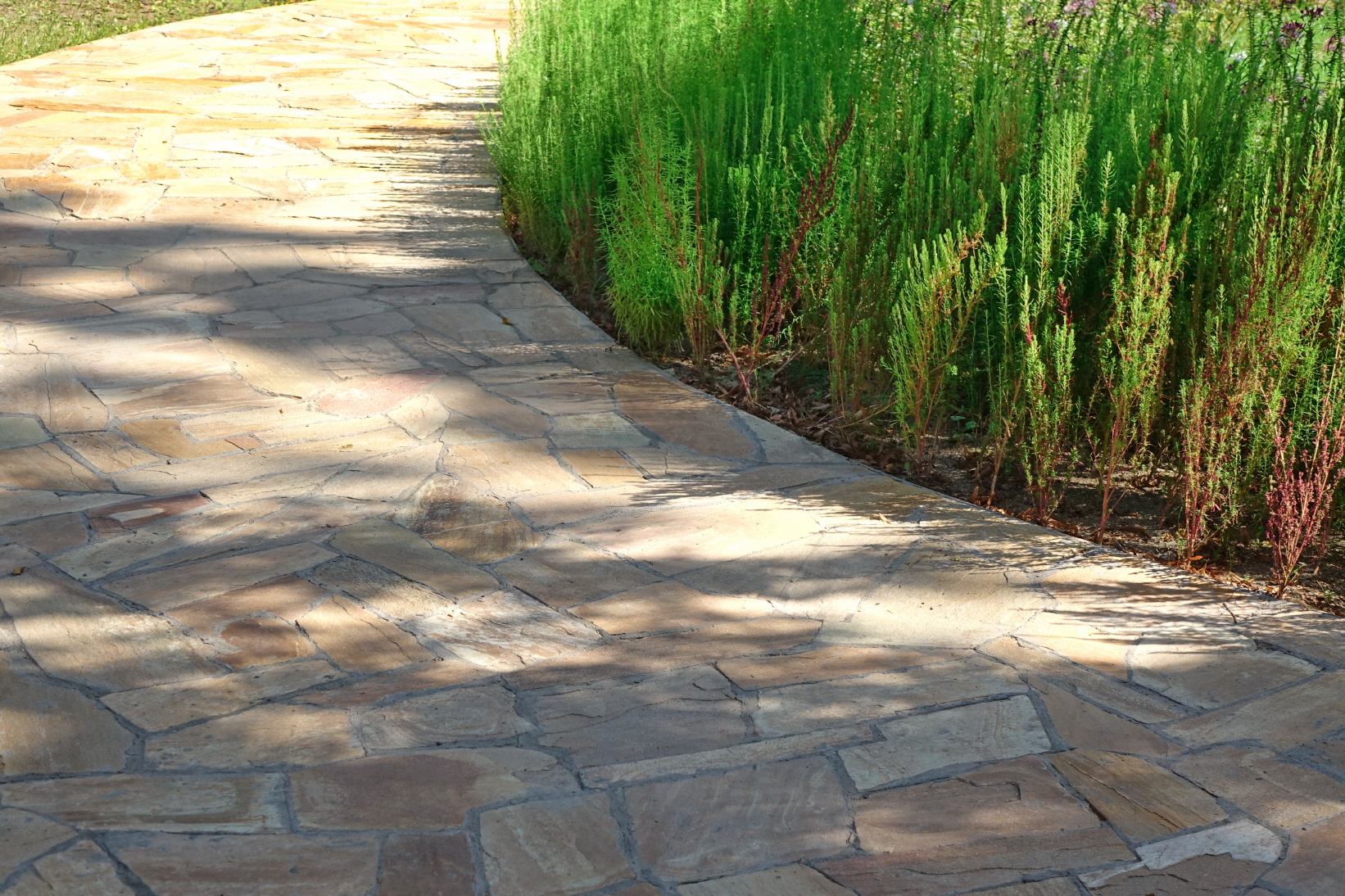 Use flagstone slabs to add a rustic feel to your walkway.