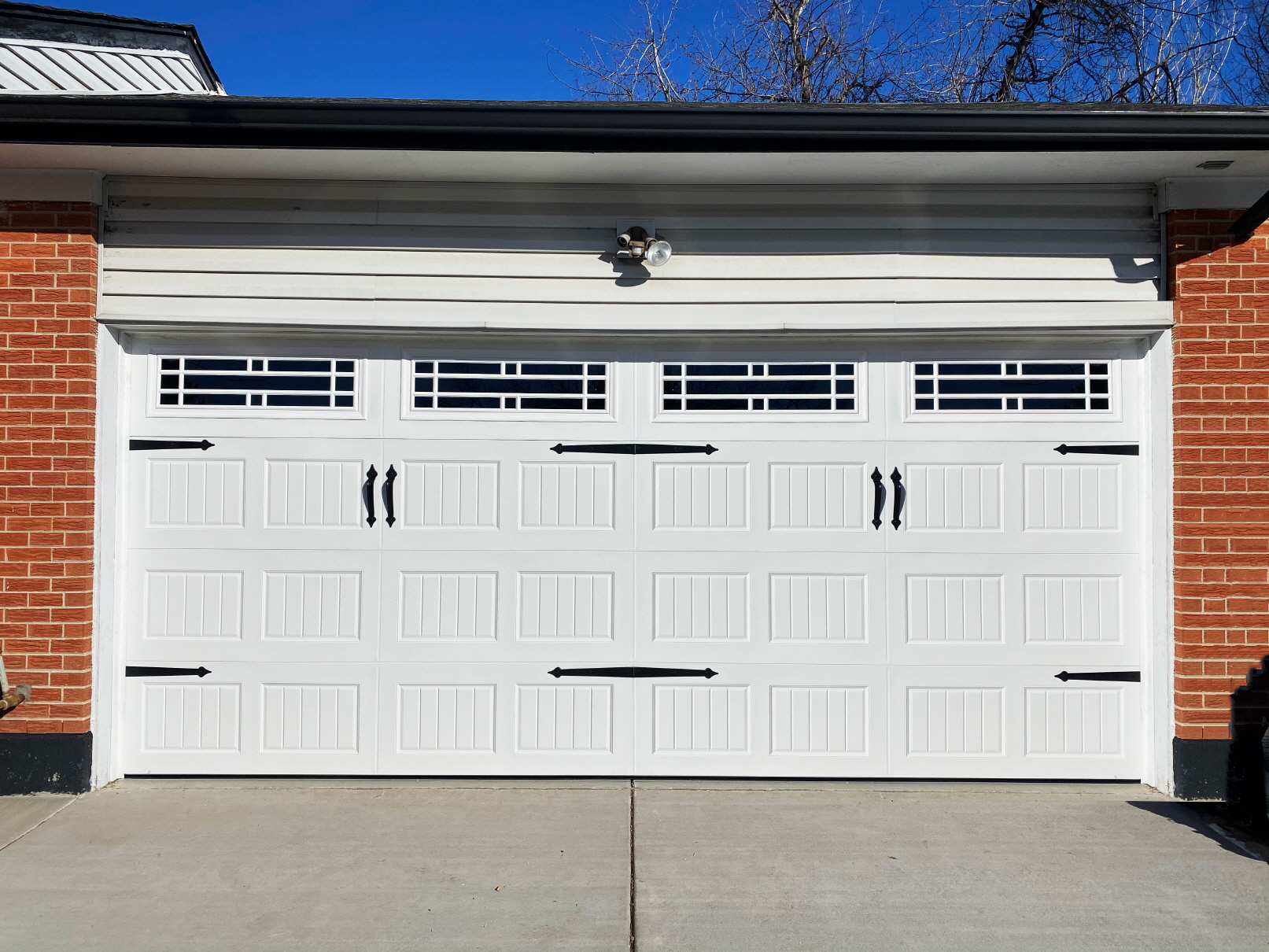 Enjoy a perfect blend of tradition and functionality by replacing your garage door with carriage-style doors.