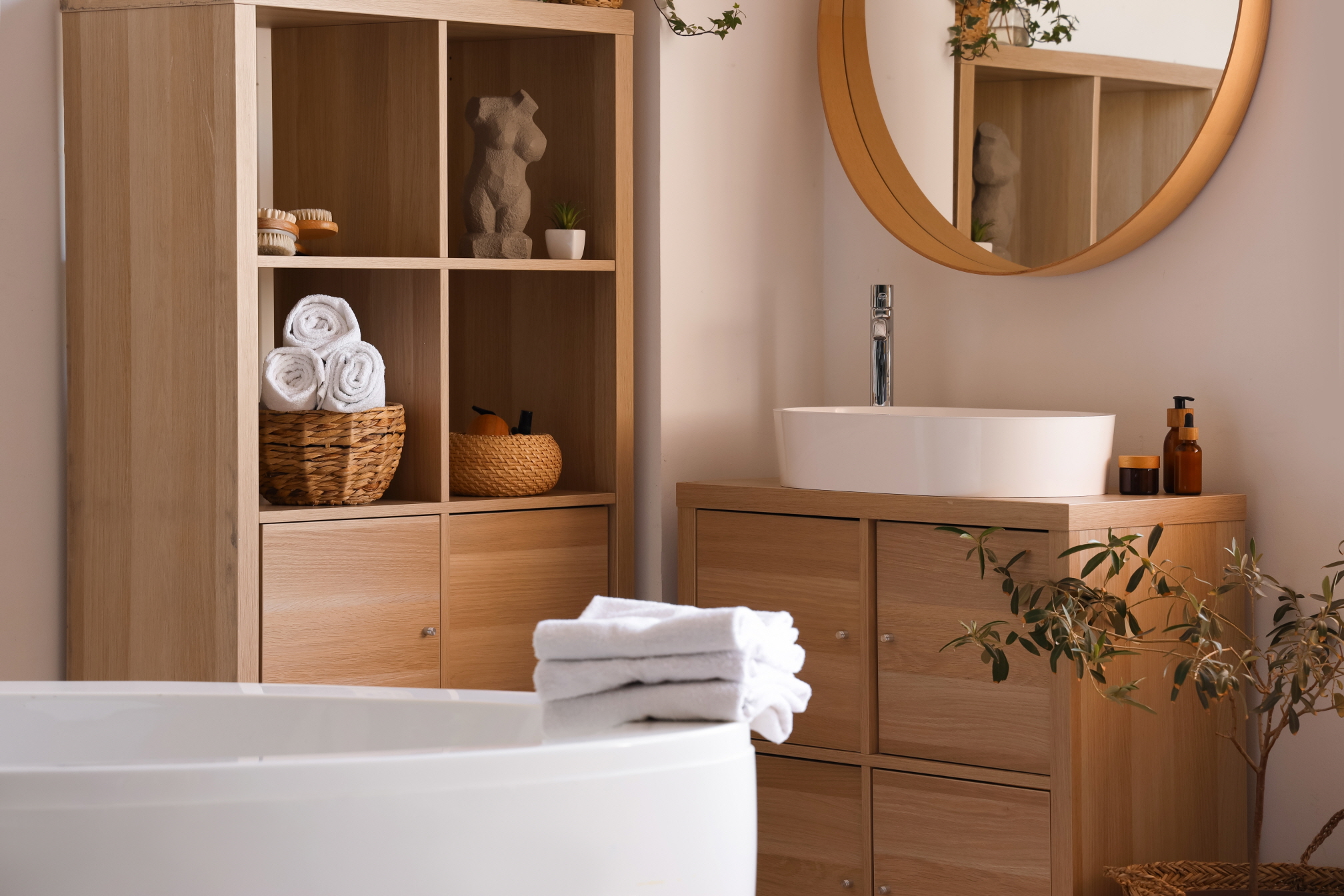 Use wooden open shelving to add sophistication to your bathroom decor.