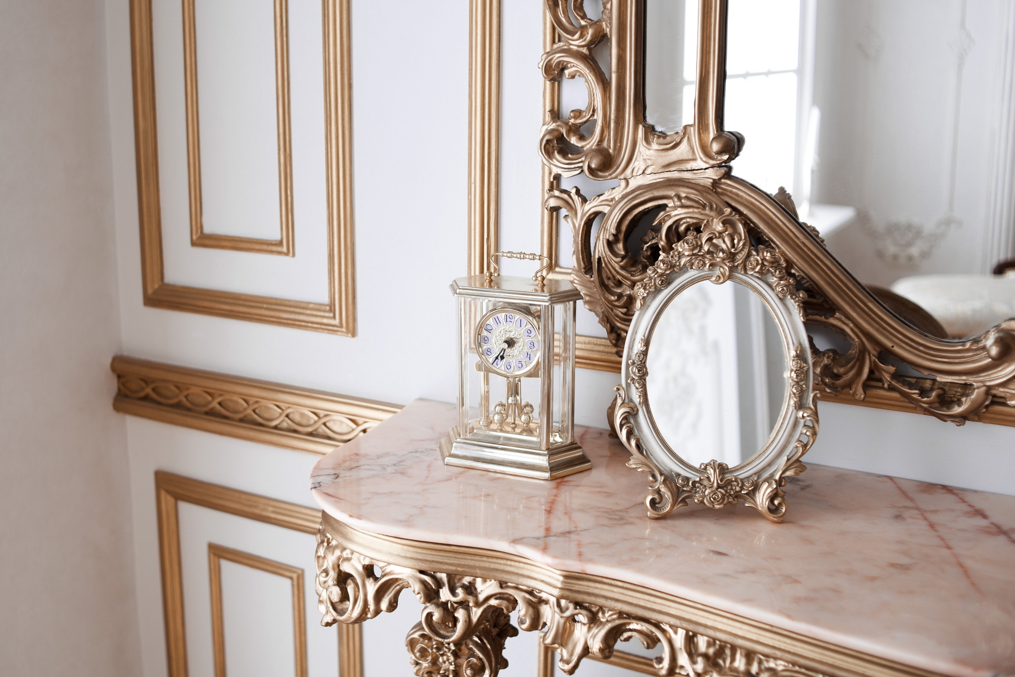 Design a chic and trendy powder room with antique mirrors.