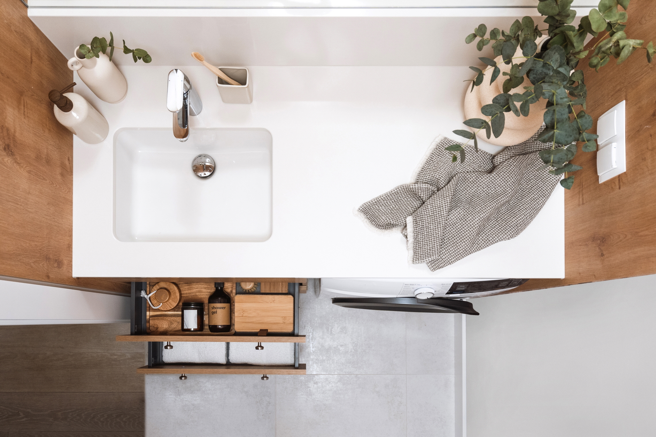 Maximize space in your powder room with smart storage solutions, such as under-sink cabinets.