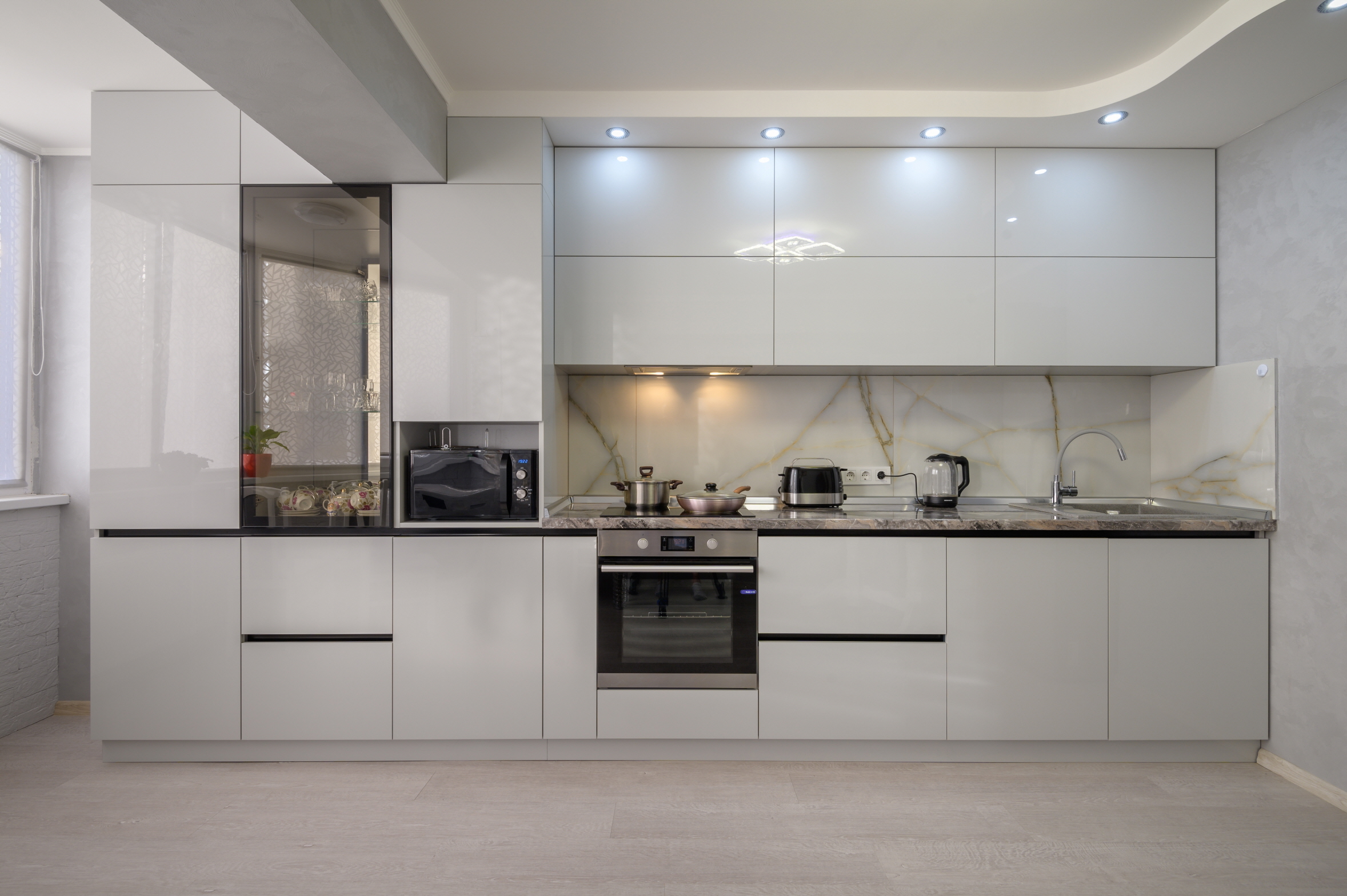 In a single-wall kitchen layout, all appliances, cabinets, and counters are arranged along one wall.