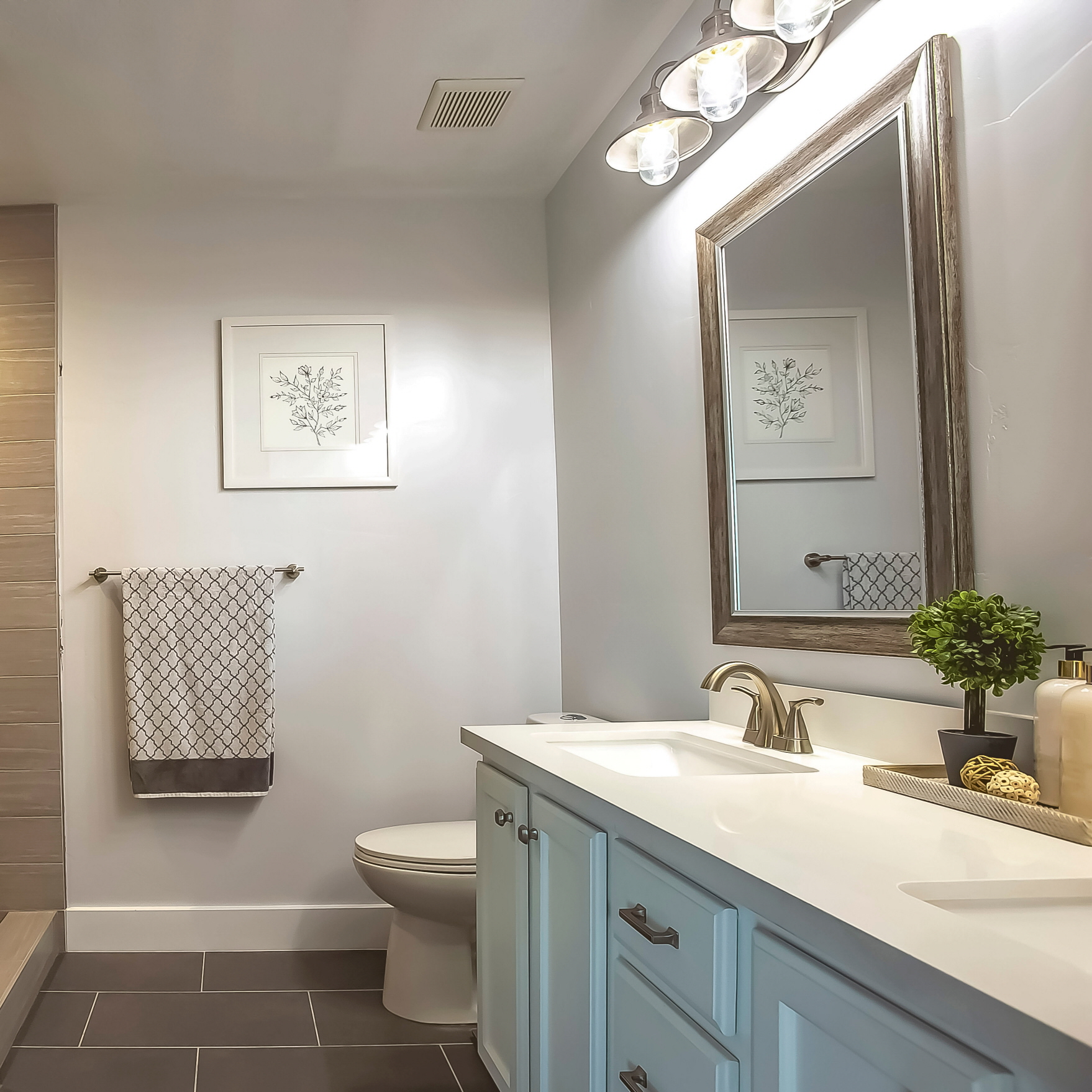 Incorporating artistic elements, such as artwork, can personalize your powder room.