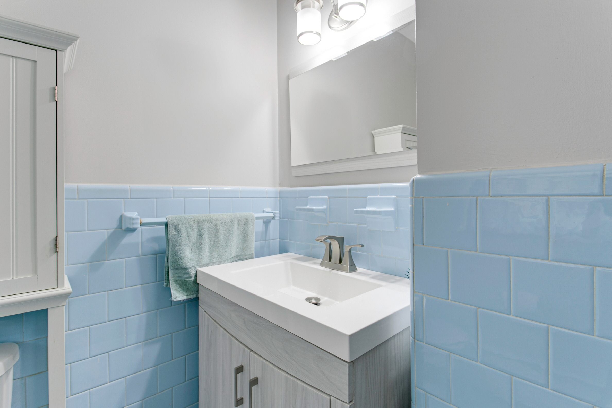 A rich, deep blue can transform your powder room into an atmospheric retreat.