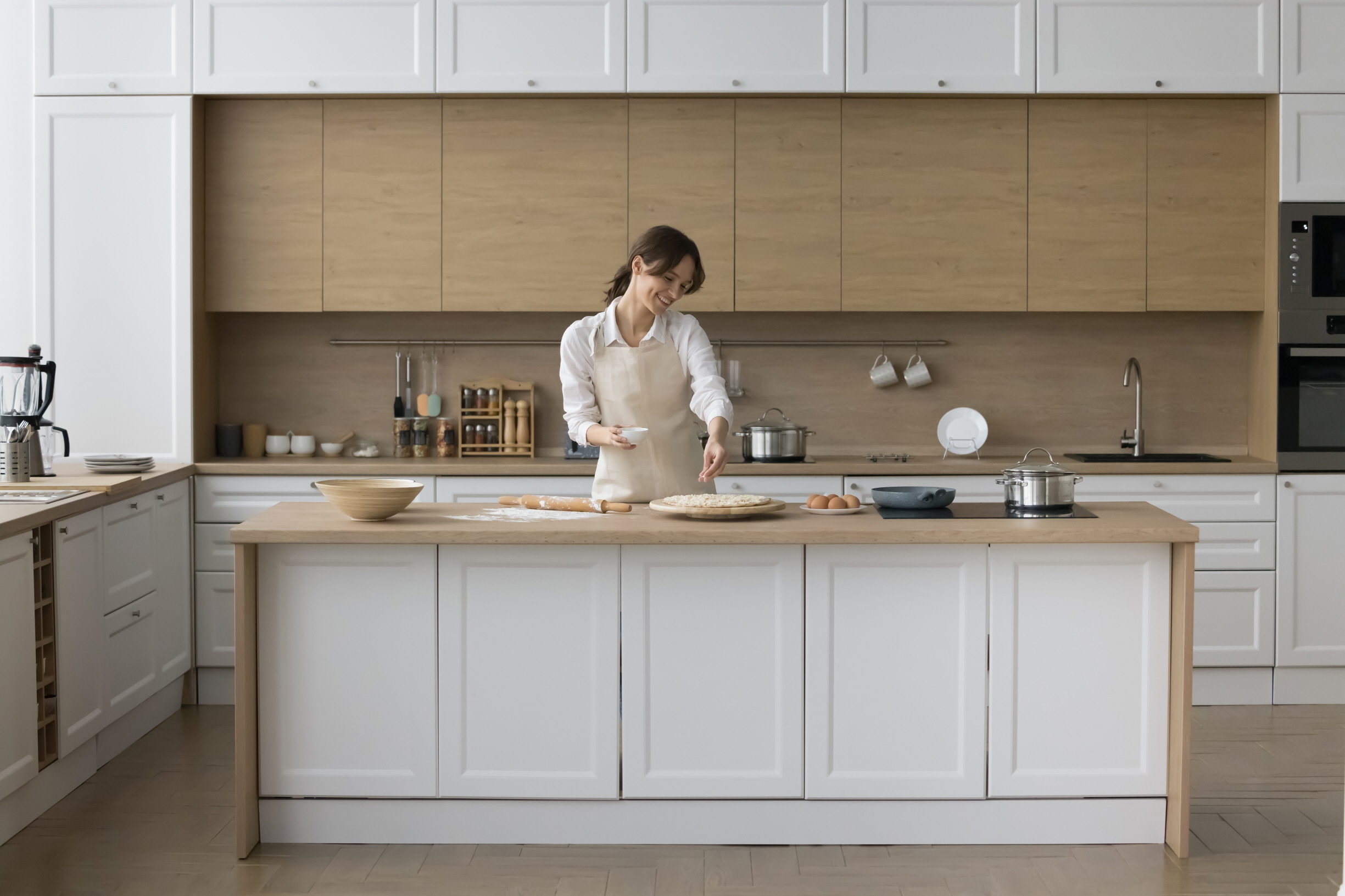 A kitchen island not only provides extra countertop space for food preparation but also offers storage options, such as lower cabinets.