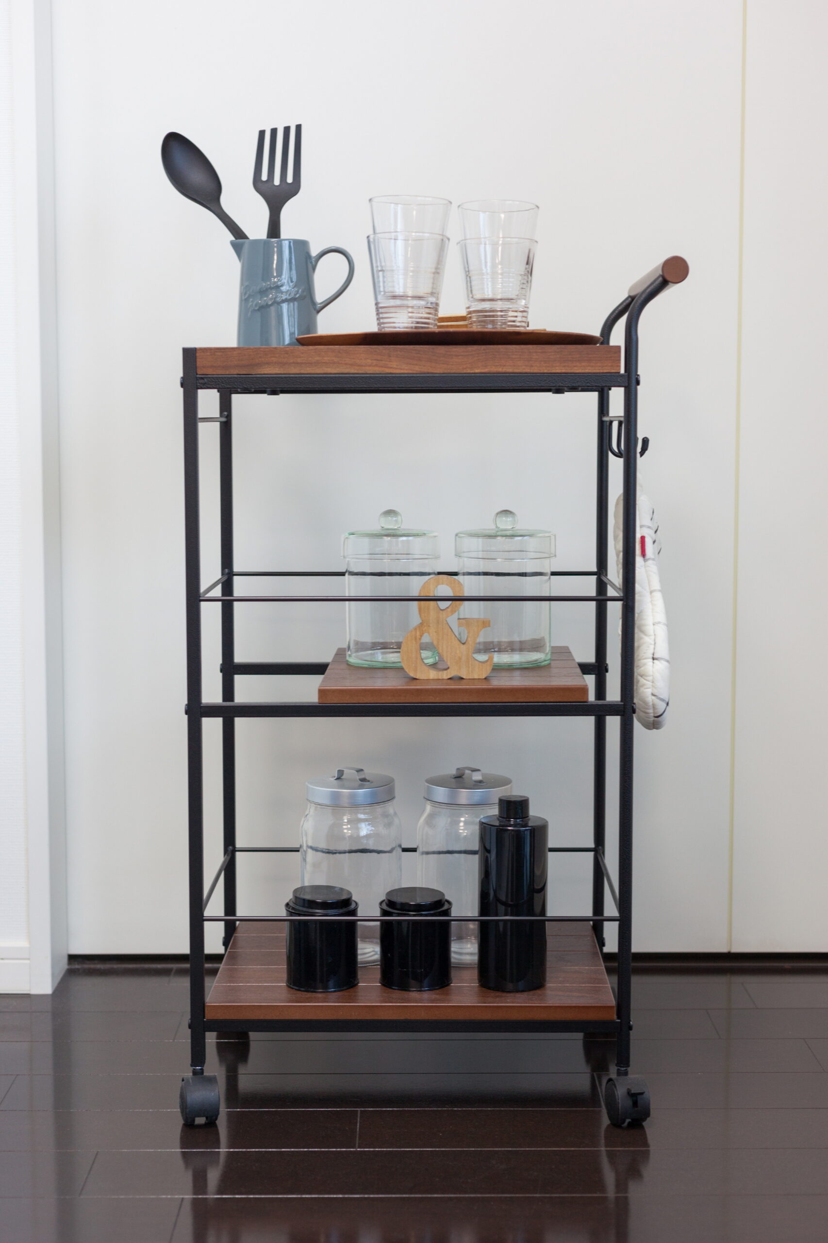 If you're struggling with limited pantry space in a compact kitchen, try using a rolling trolley cart.