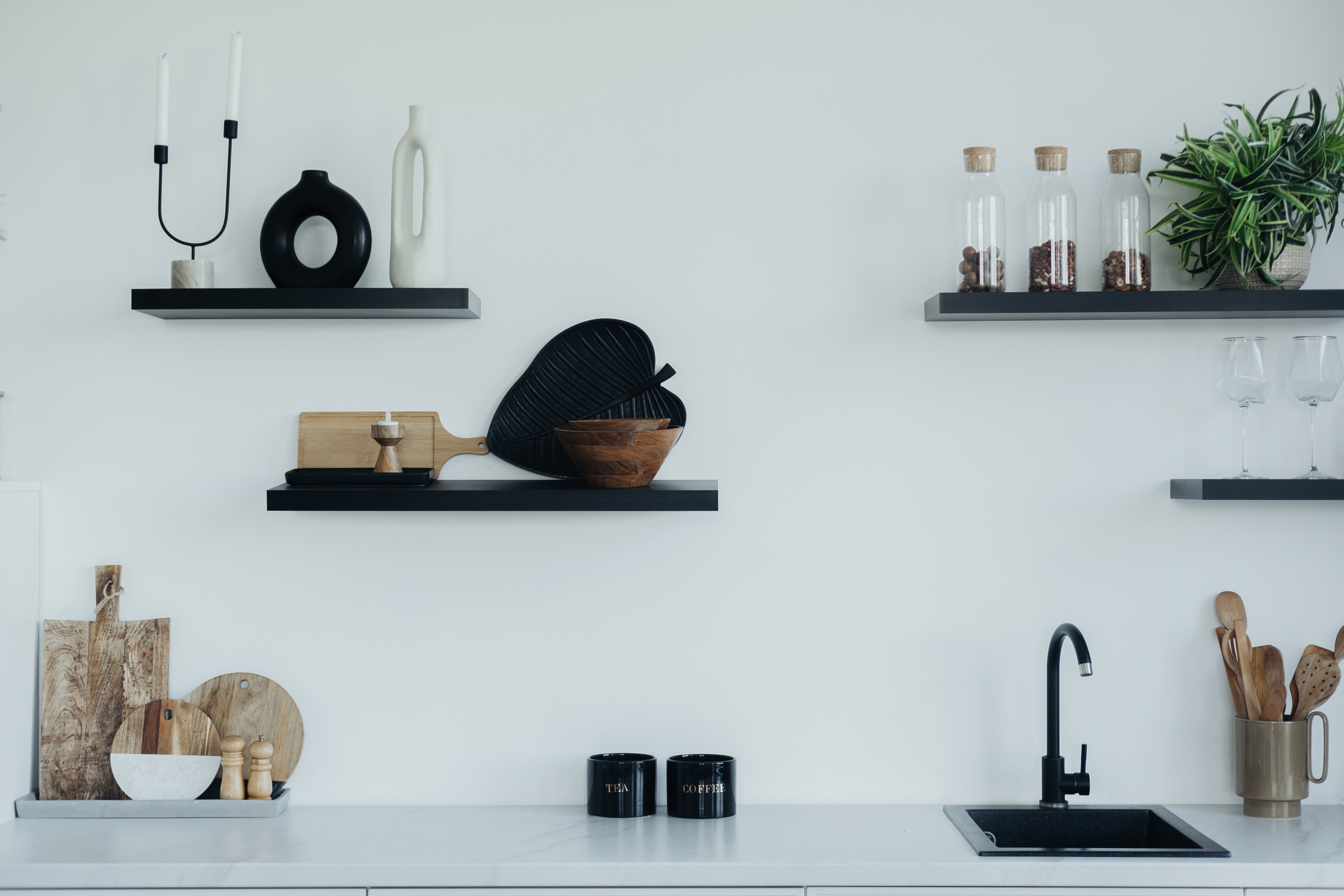 Open shelving is an efficient way to use vertical space and keep essentials within reach.