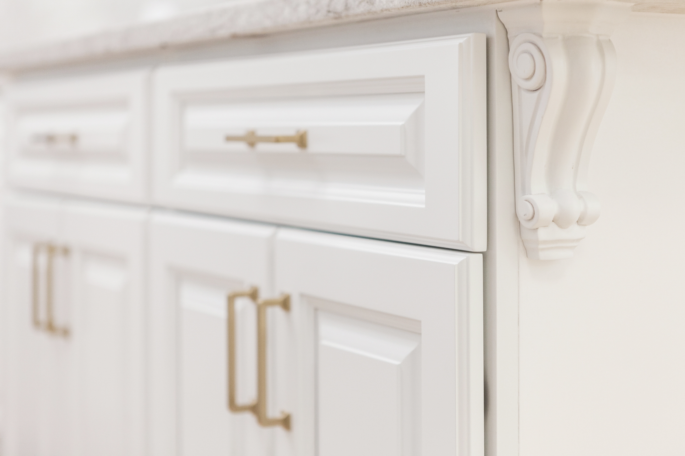 The frame of raised-panel cabinet doors adds texture and depth to the cabinetry.